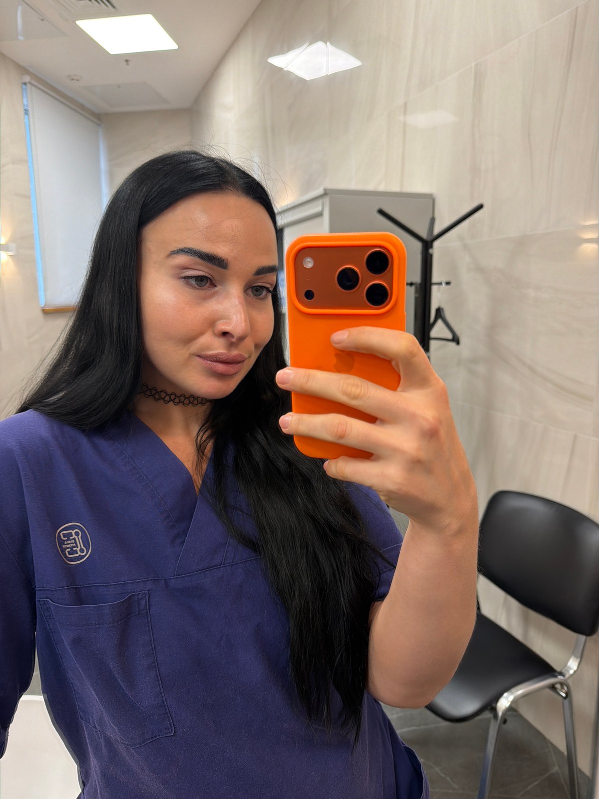 Woman Takes Selfies at Professional Office in Saint Petersburg