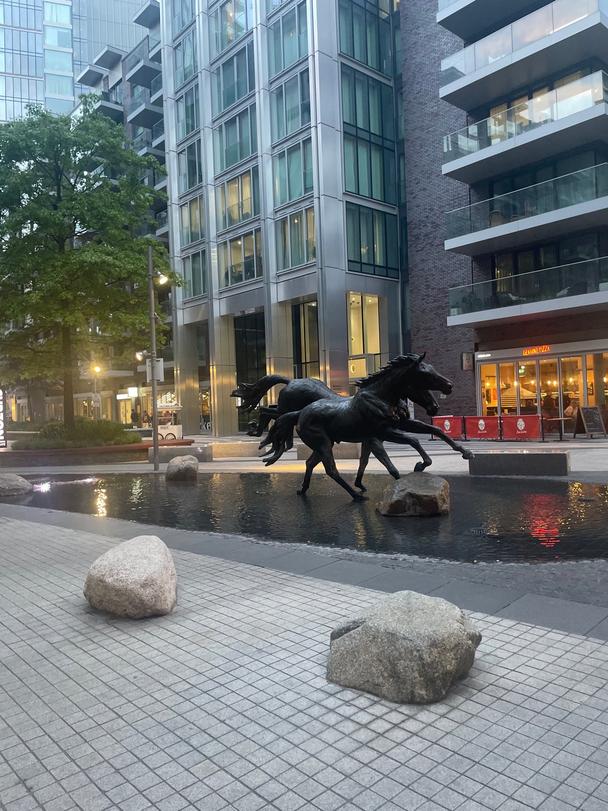 Bronze horse sculpture observed in London water feature