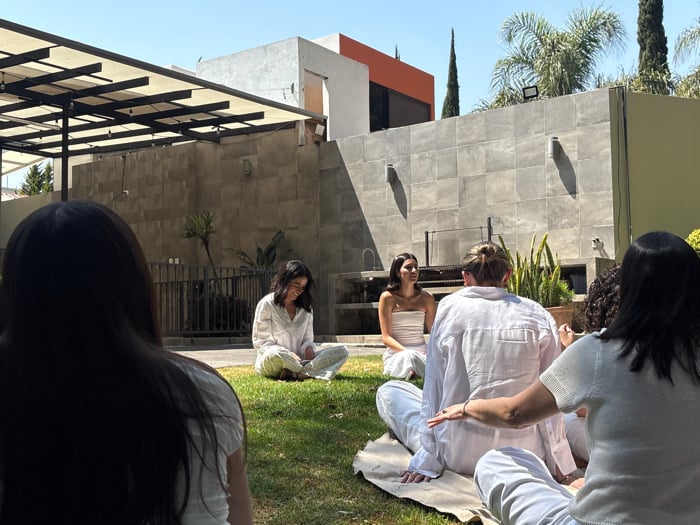 Women gather on residential lawn in Puebla, Mexico