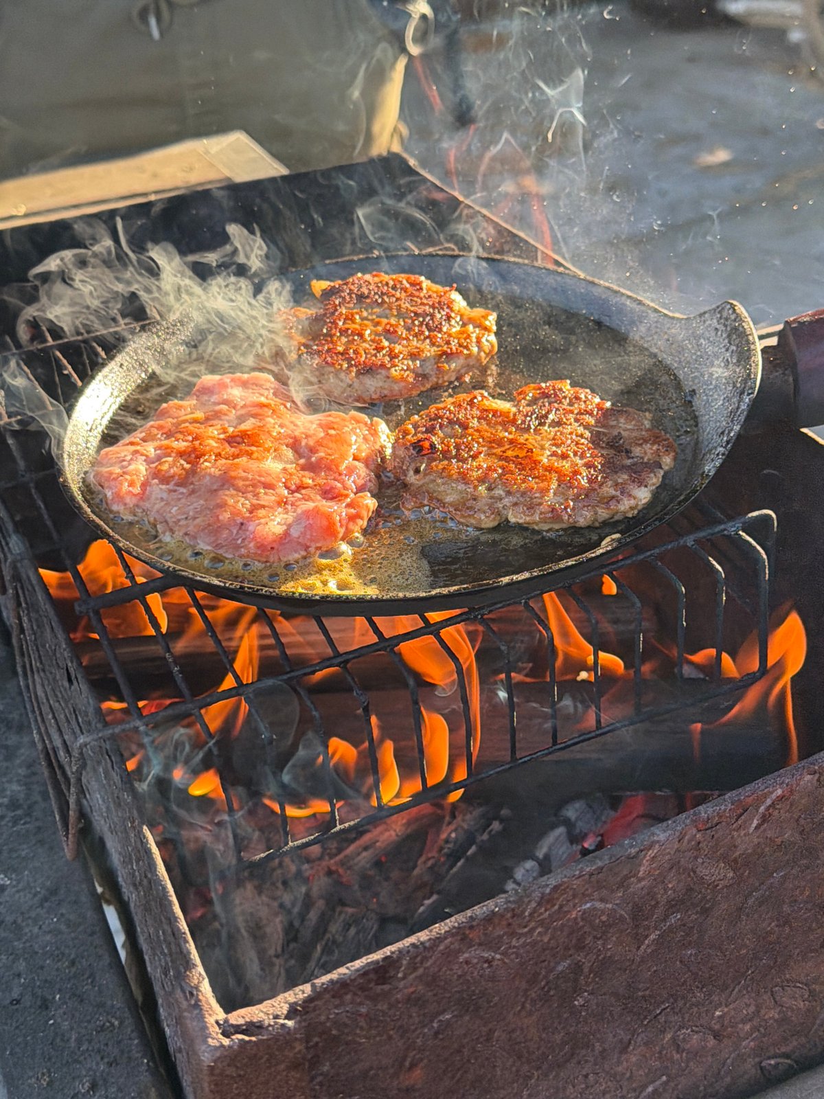 Outdoor cooking session documented in Большая Шильна, Russia