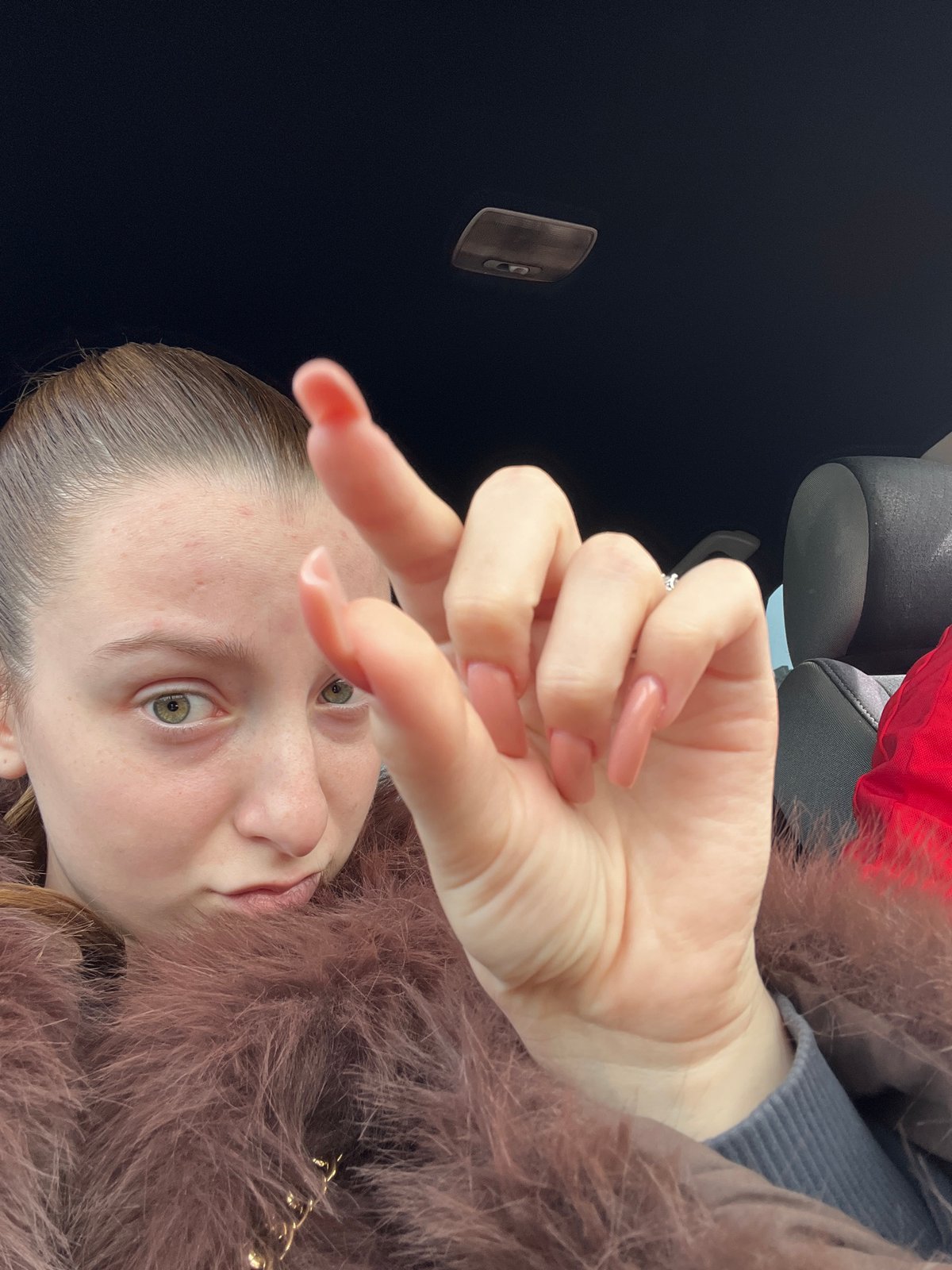 Two people photographed in car during early morning in Varna