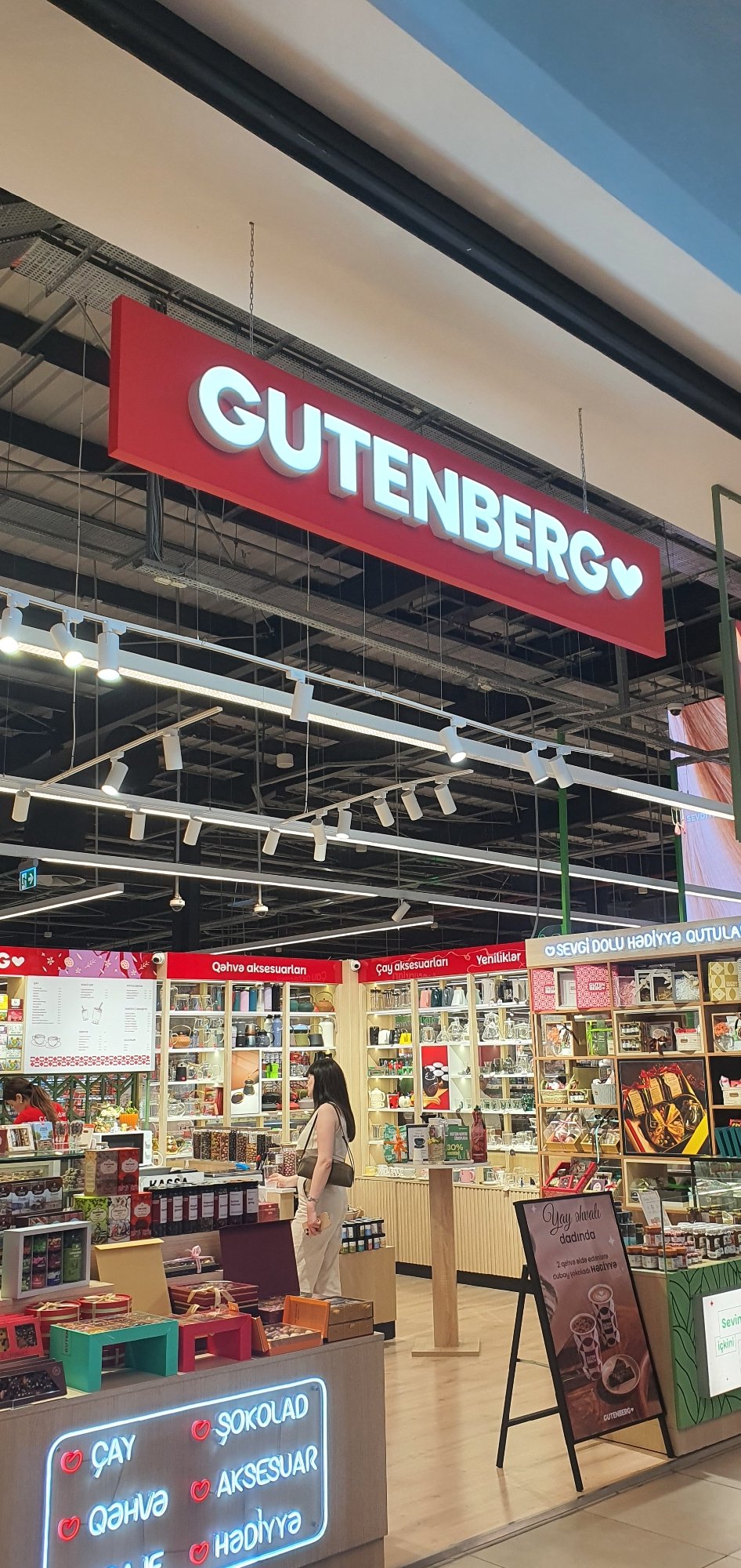 Retail browsing across Baku storefronts, from books to bubble tea
