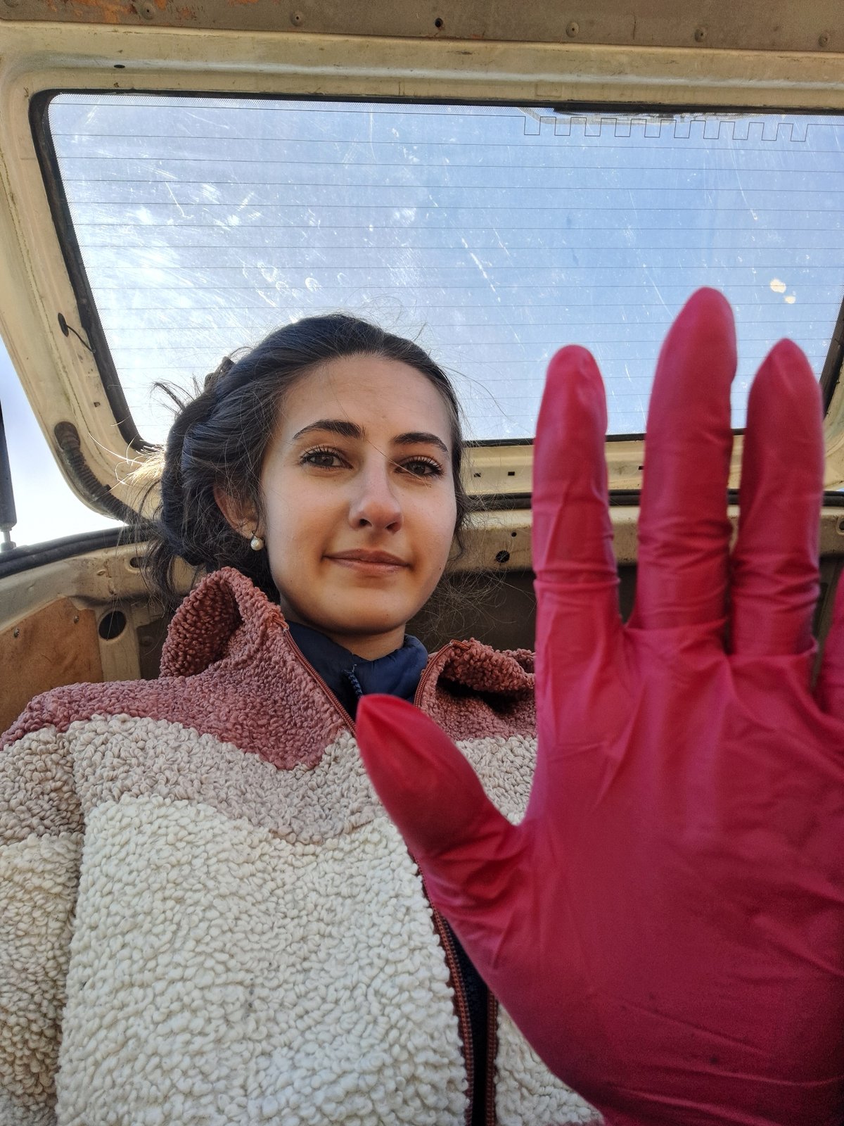 Woman photographed near vehicle in rural Bulgarian village