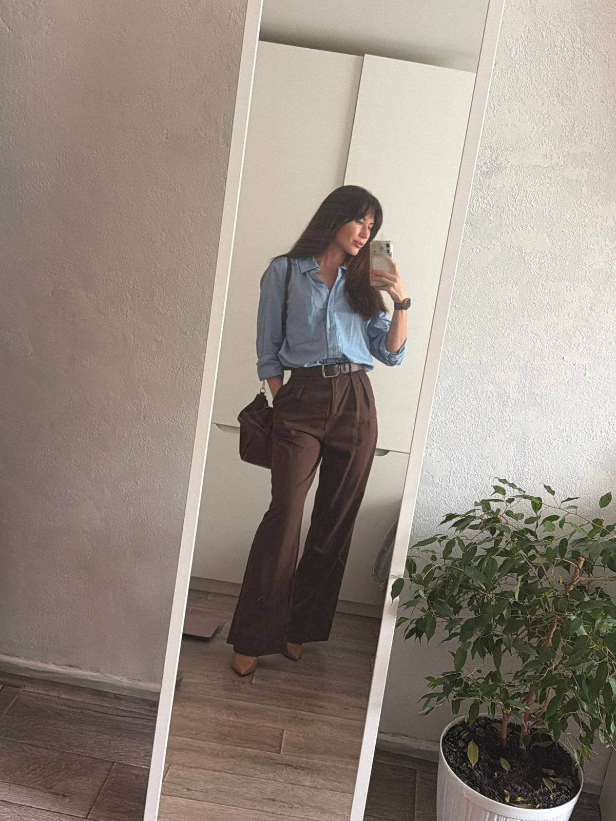Woman takes selfies in various Perm locations during morning
