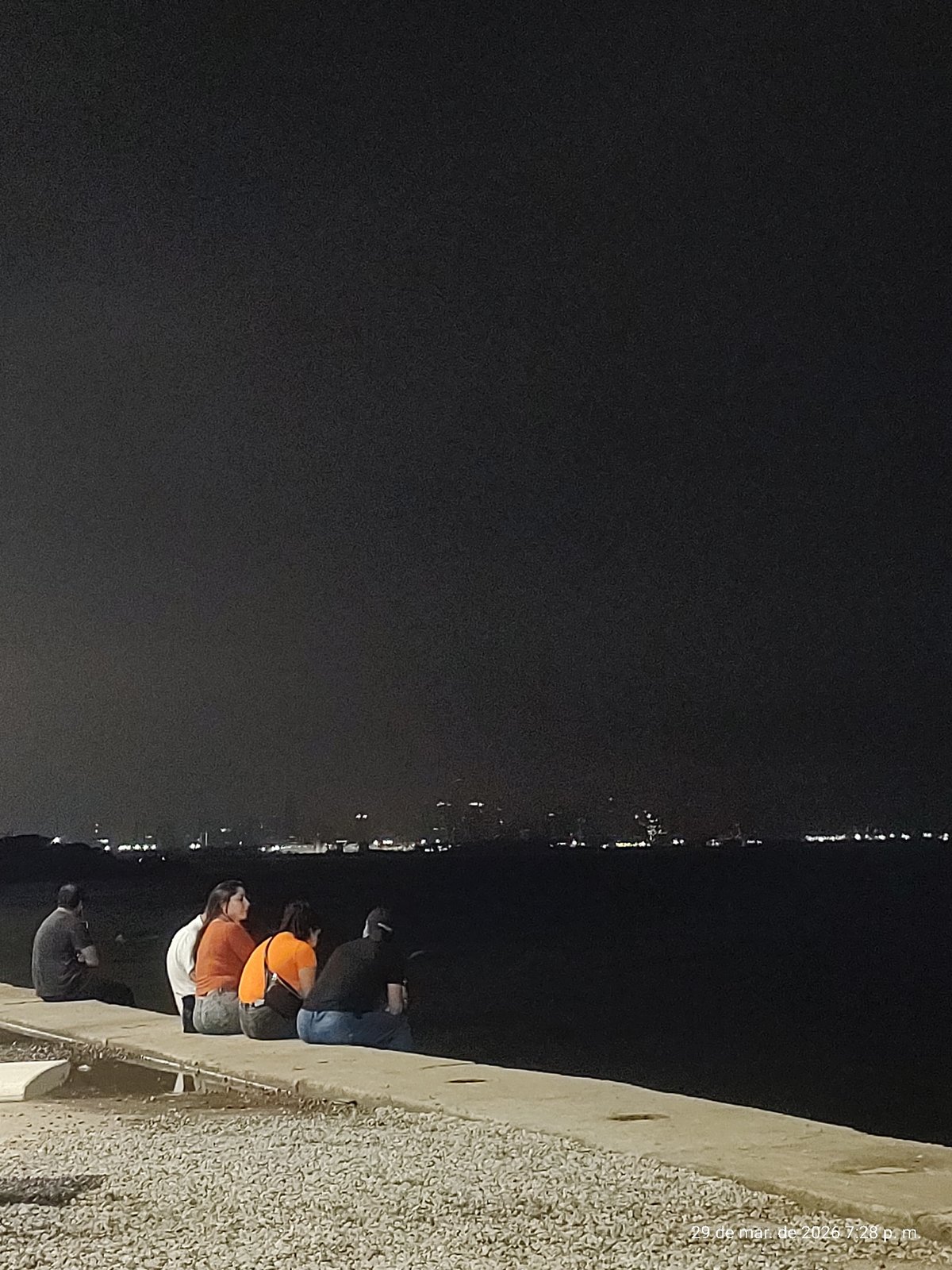Evening gathering at Villa Domínico waterfront park draws visitors