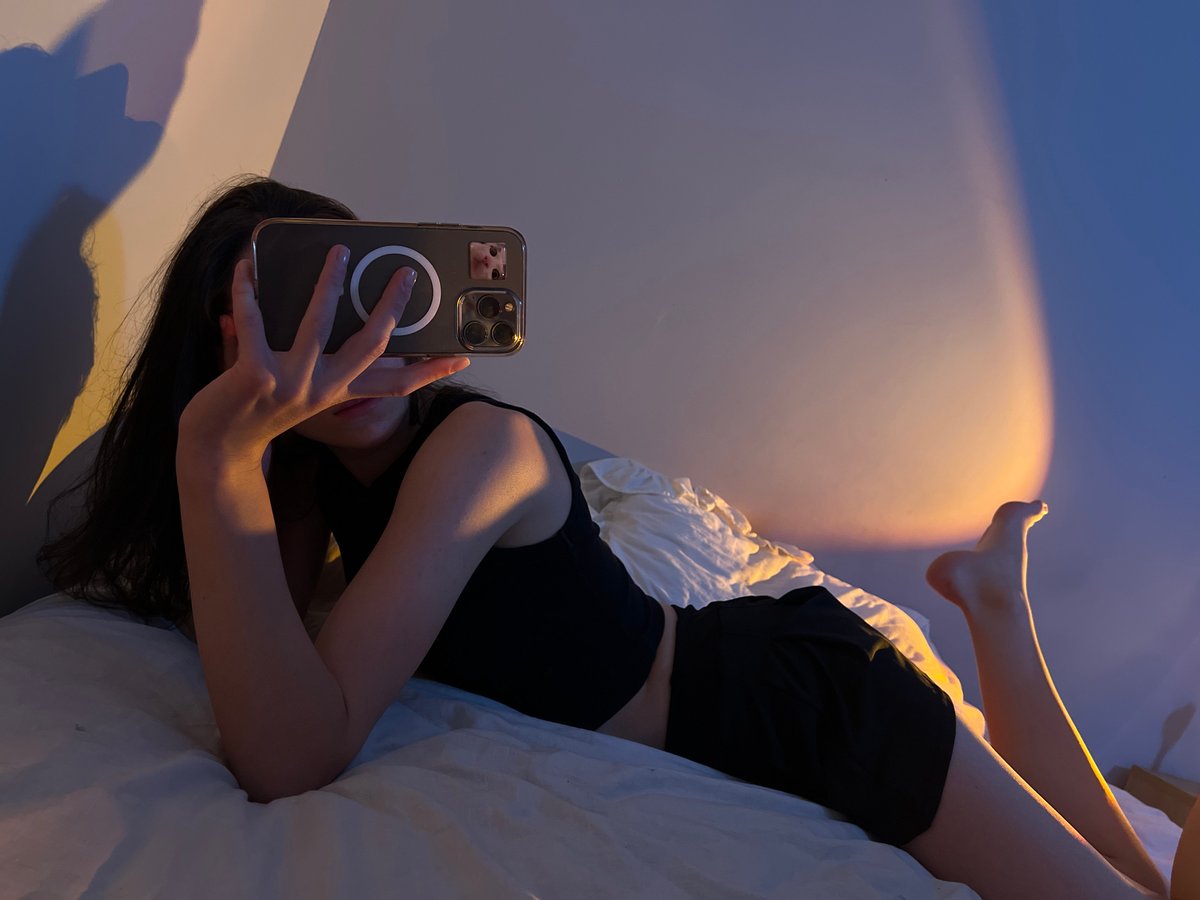 Evening bedroom photo session with golden lighting in Ternopil