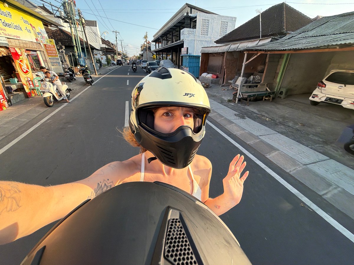 Motorcycle selfies taken mid-ride through Mengwi streets