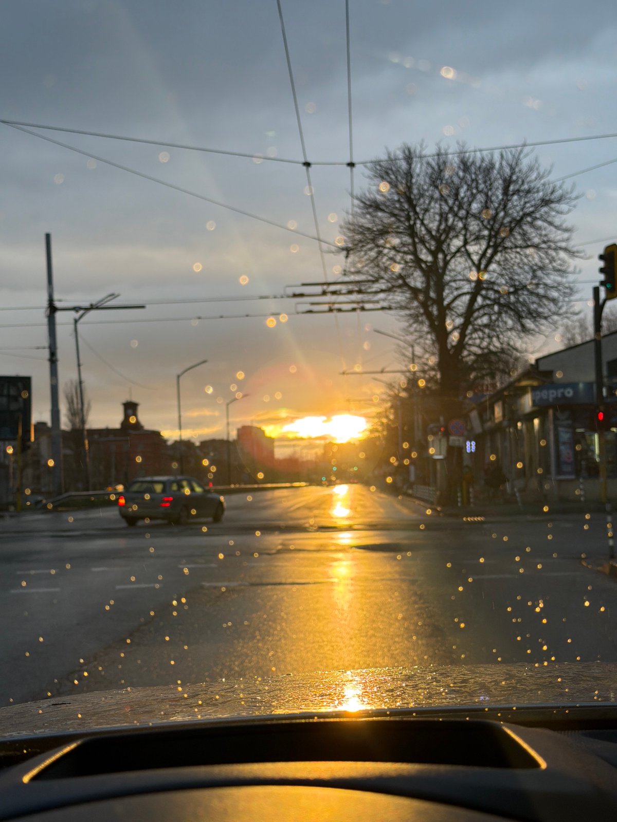 Rainy street view through car window in Sofia
