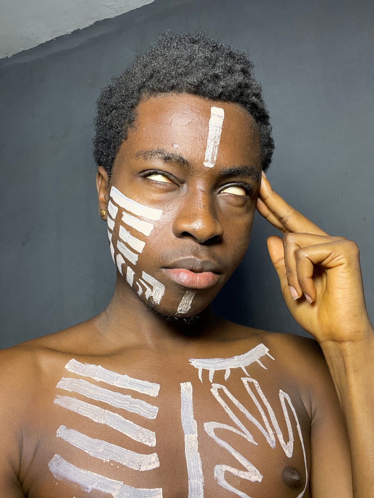 Man with traditional white body paint observed in Nkpor