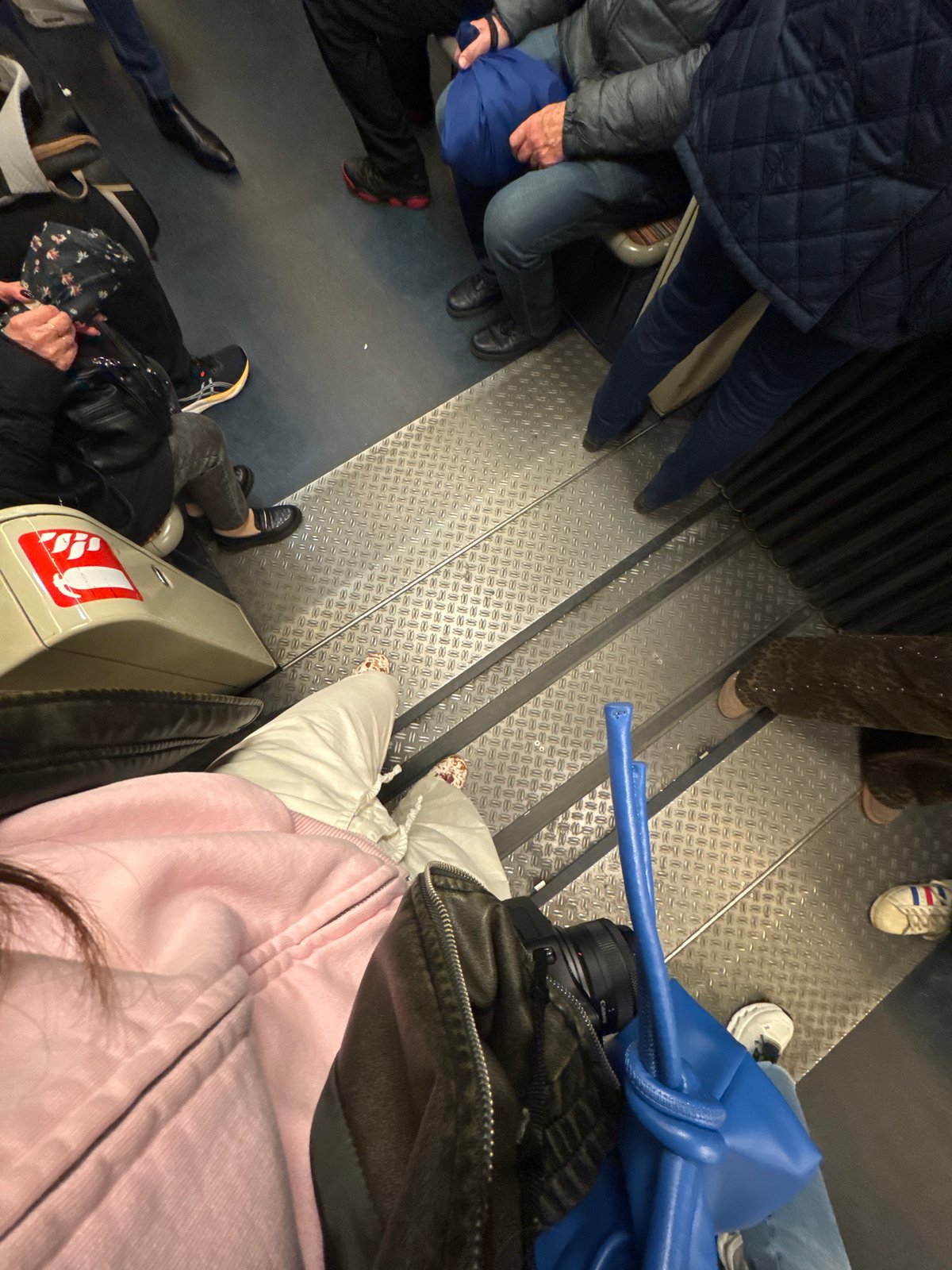 Passengers ride Paris metro during midday commute