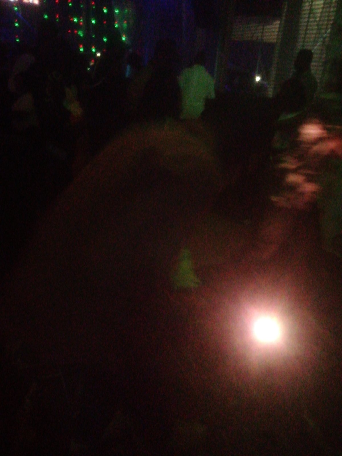 Nighttime party with live drums documented in Jos, Nigeria