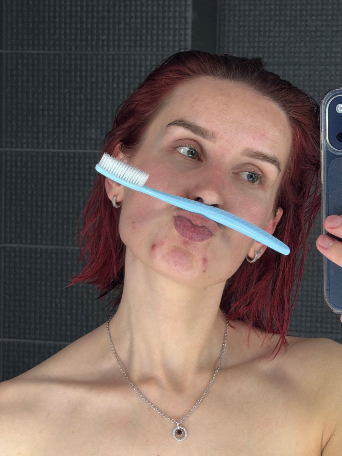 Person takes bathroom selfies after bathing in Chaikovsky, Russia