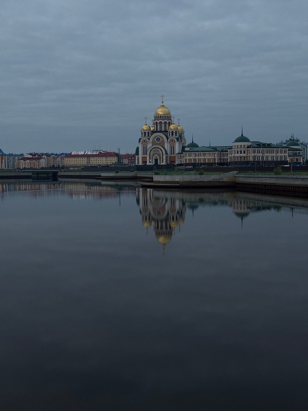 Salekhard's riverfront: golden domes and the Chum Bridge