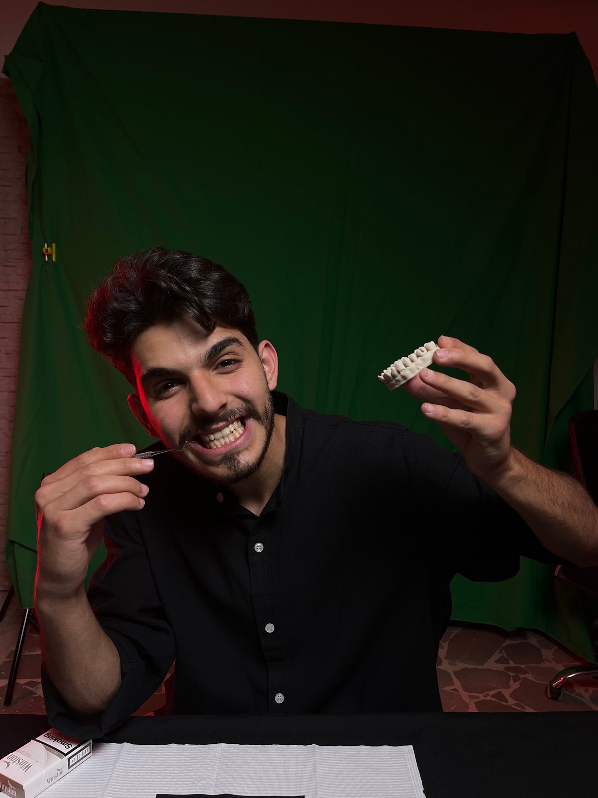 Man works on dental prosthetics in Damascus suburb