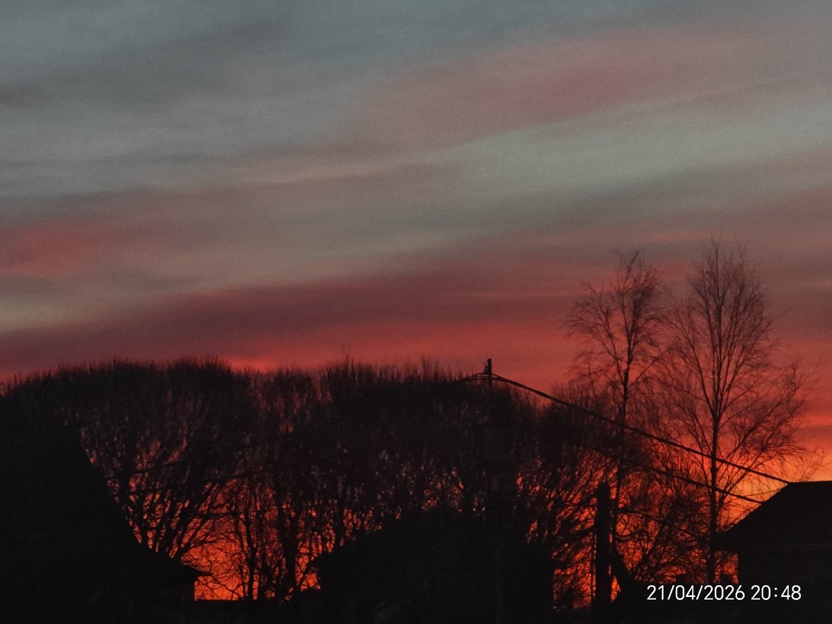 Dramatic sunset displays intense colors across sky April 21