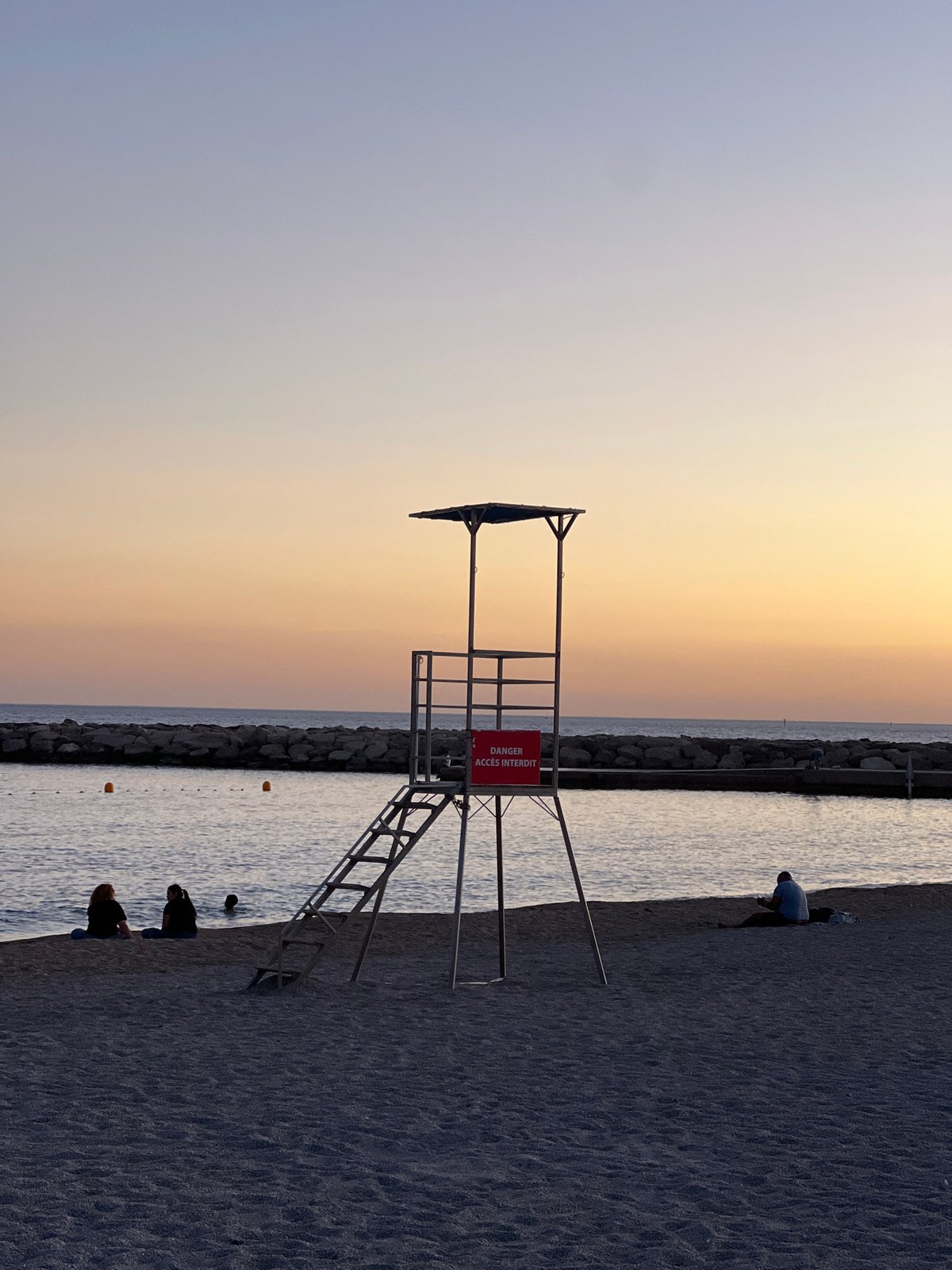Marseille Beach Captured at Dusk with Calanques Backdrop