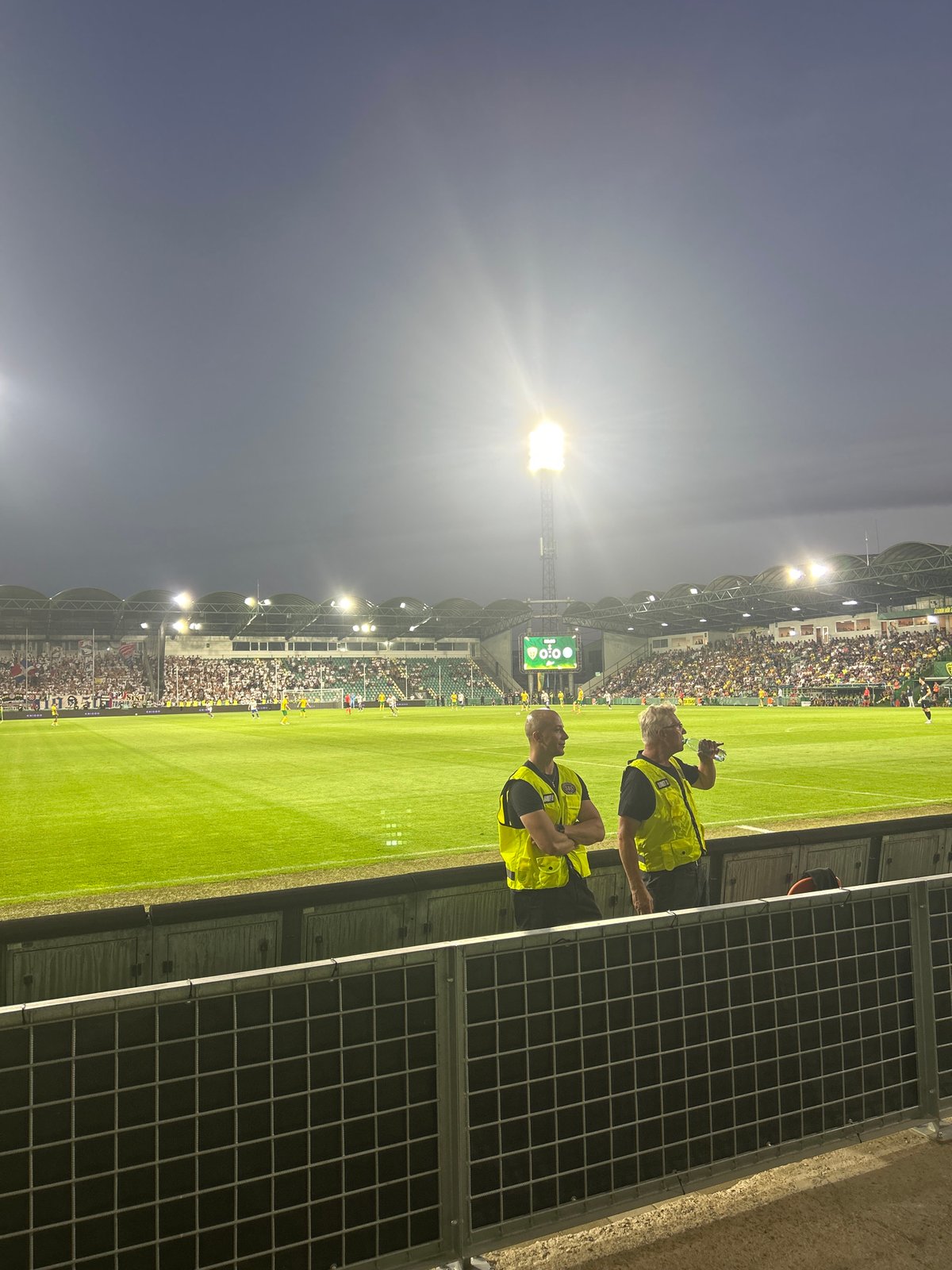 Evening football match at floodlit Žilina stadium
