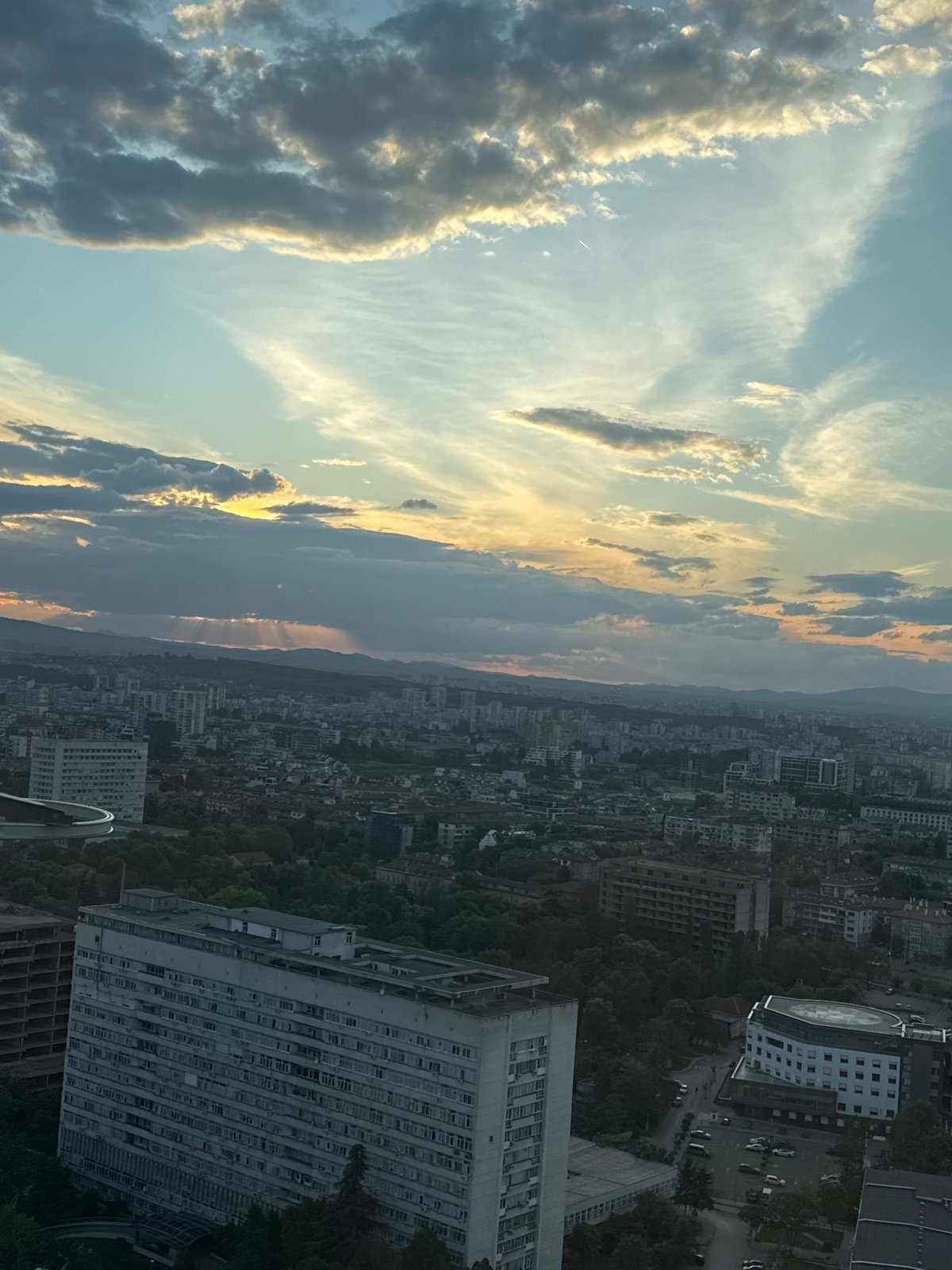 Dramatic clouds captured over Sofia cityscape from aerial view