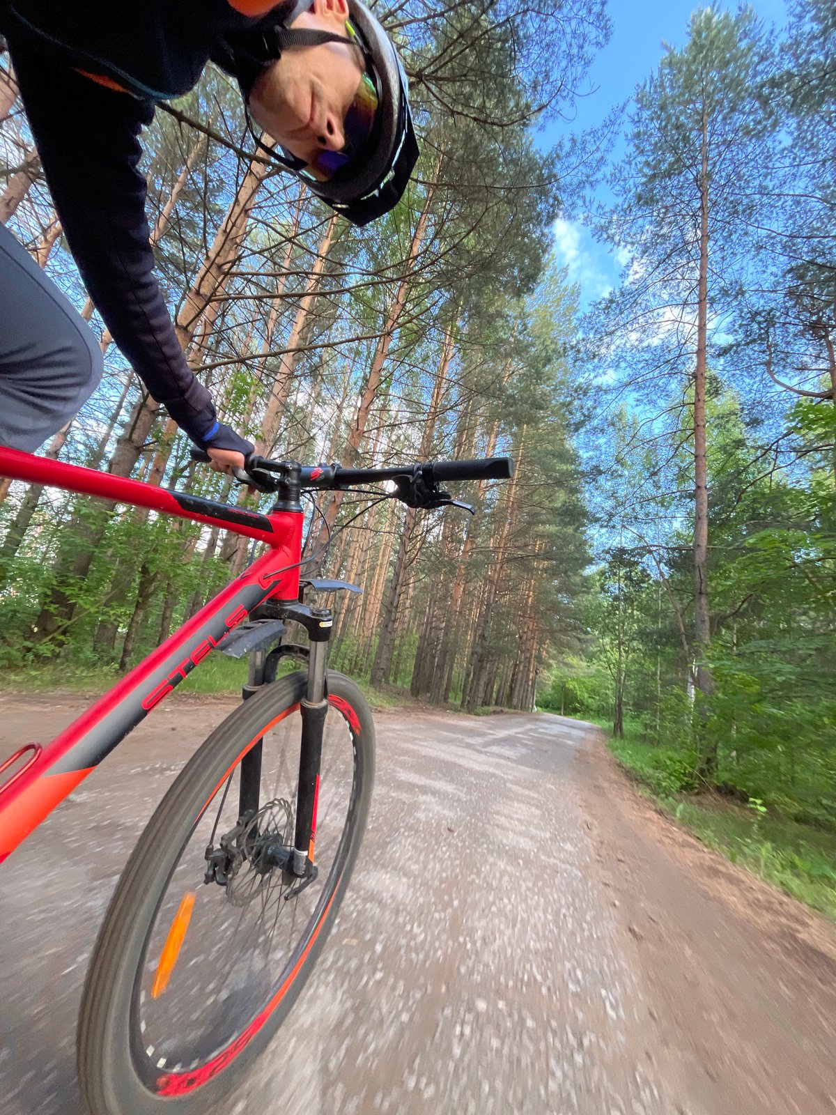 Woman enjoys biking and photography during sunny afternoon in Chaikovsky