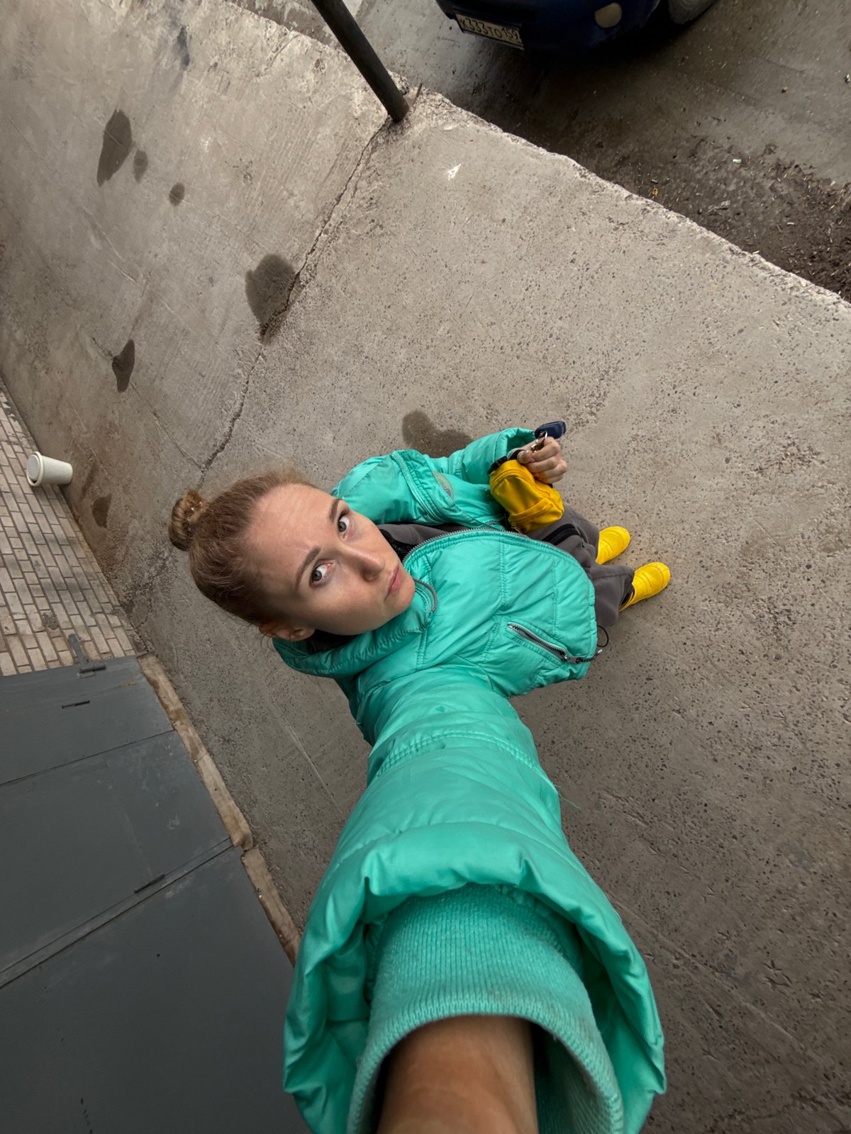 Person in teal jacket photographed in Chaikovsky, Russia