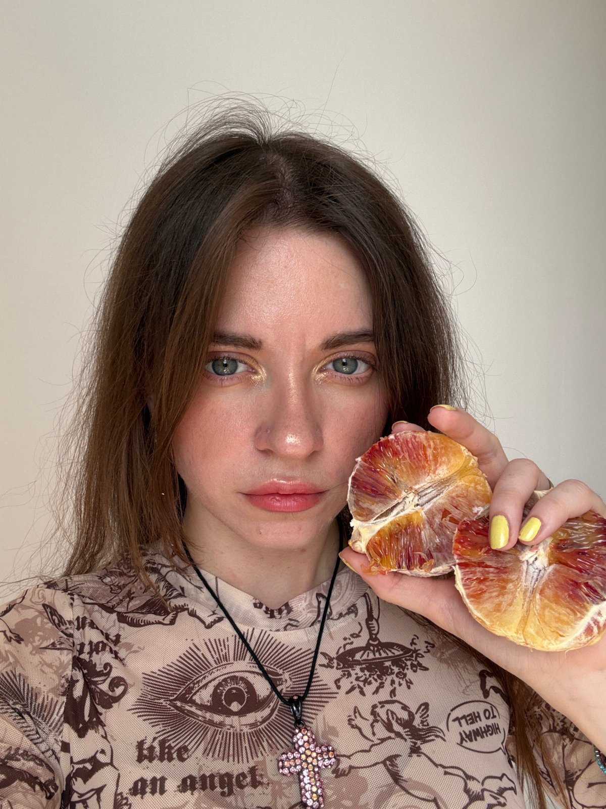 Woman poses with blood oranges in Moscow photoshoot
