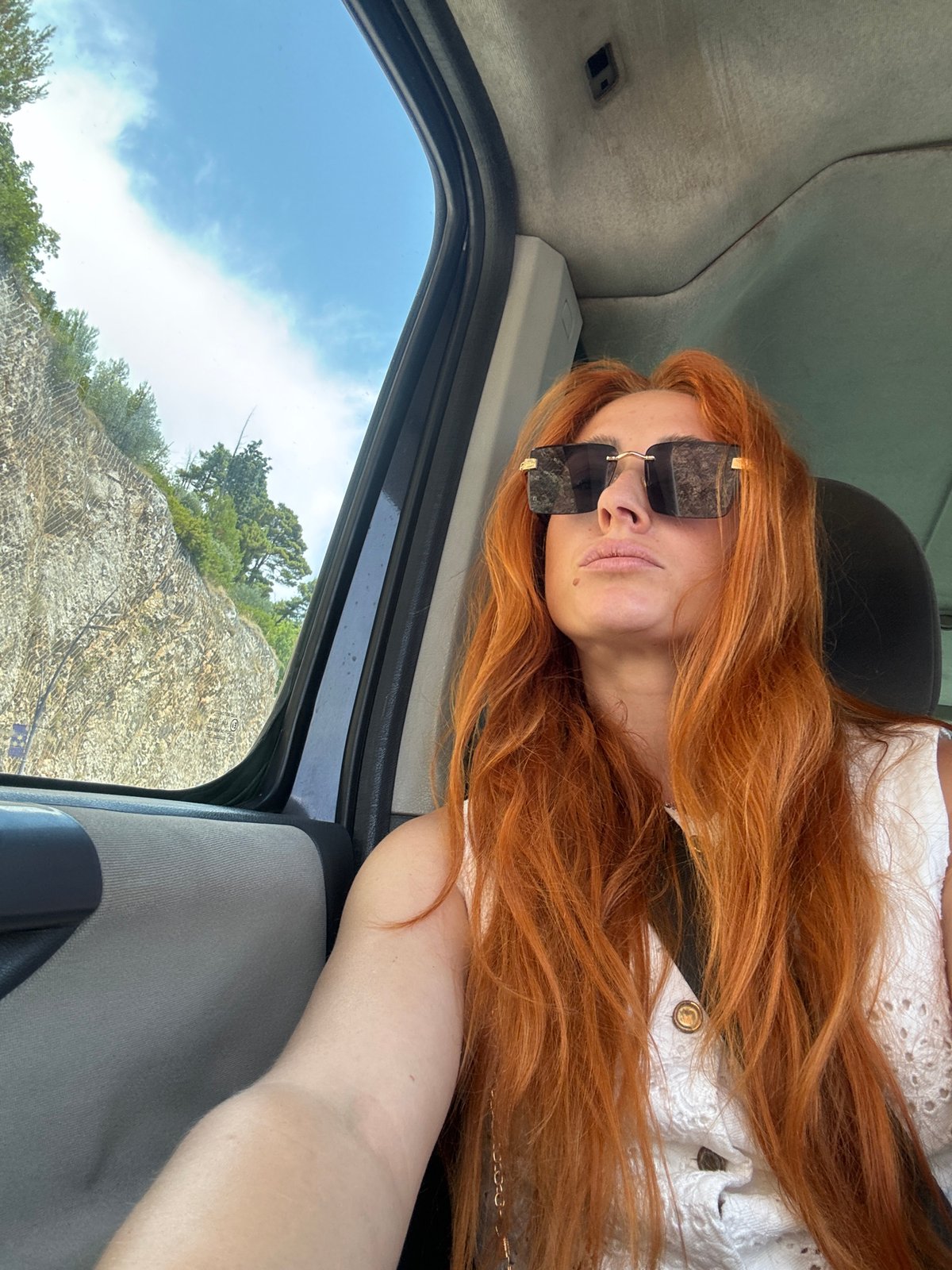 Inside a car on a sunny Budva street, June 2026