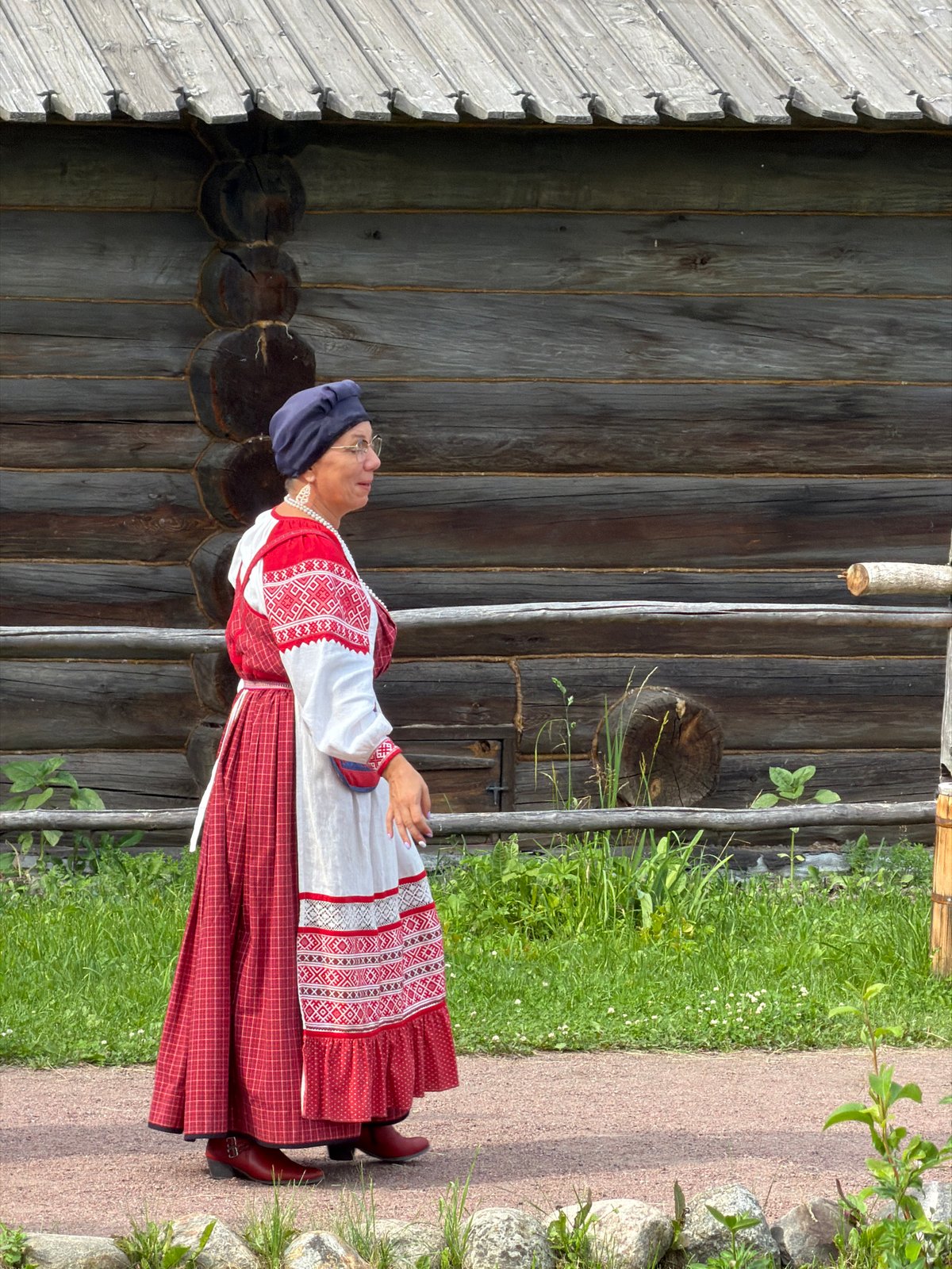 Traditional wooden architecture and folk dress at Dnp Ryzhiki