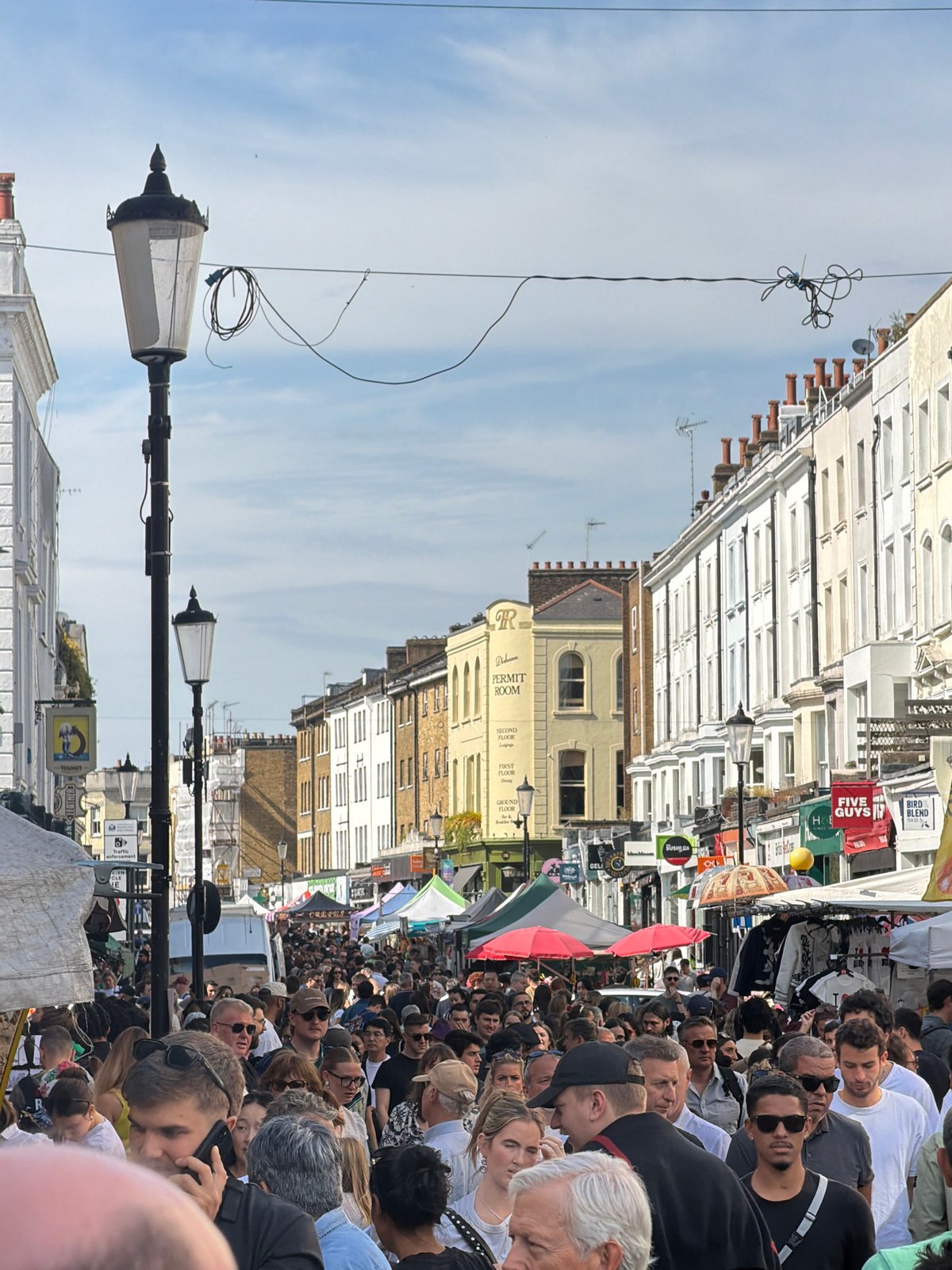 Crowds gather on London street during afternoon event