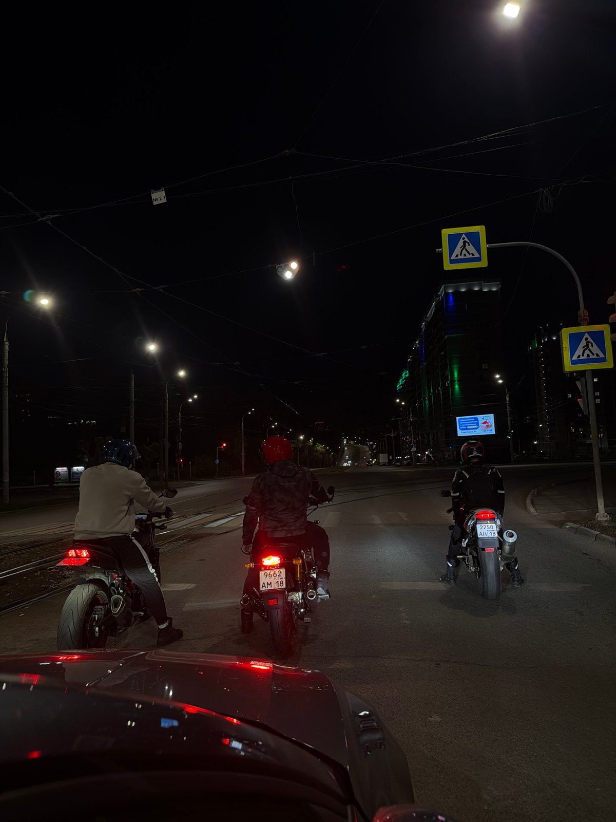 Motorcycles gather at nighttime intersection in Izhevsk, Russia