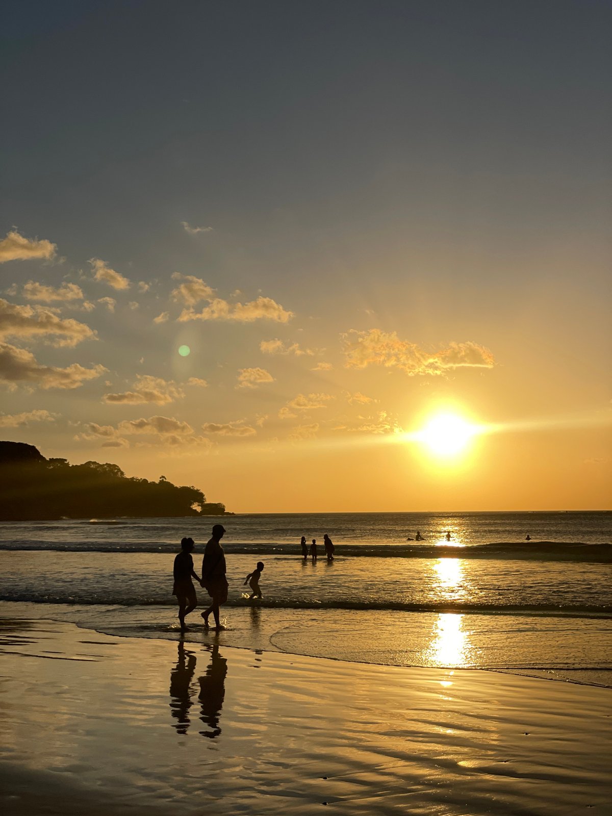 Kuta Beach at golden hour: horses, sports, and vendors