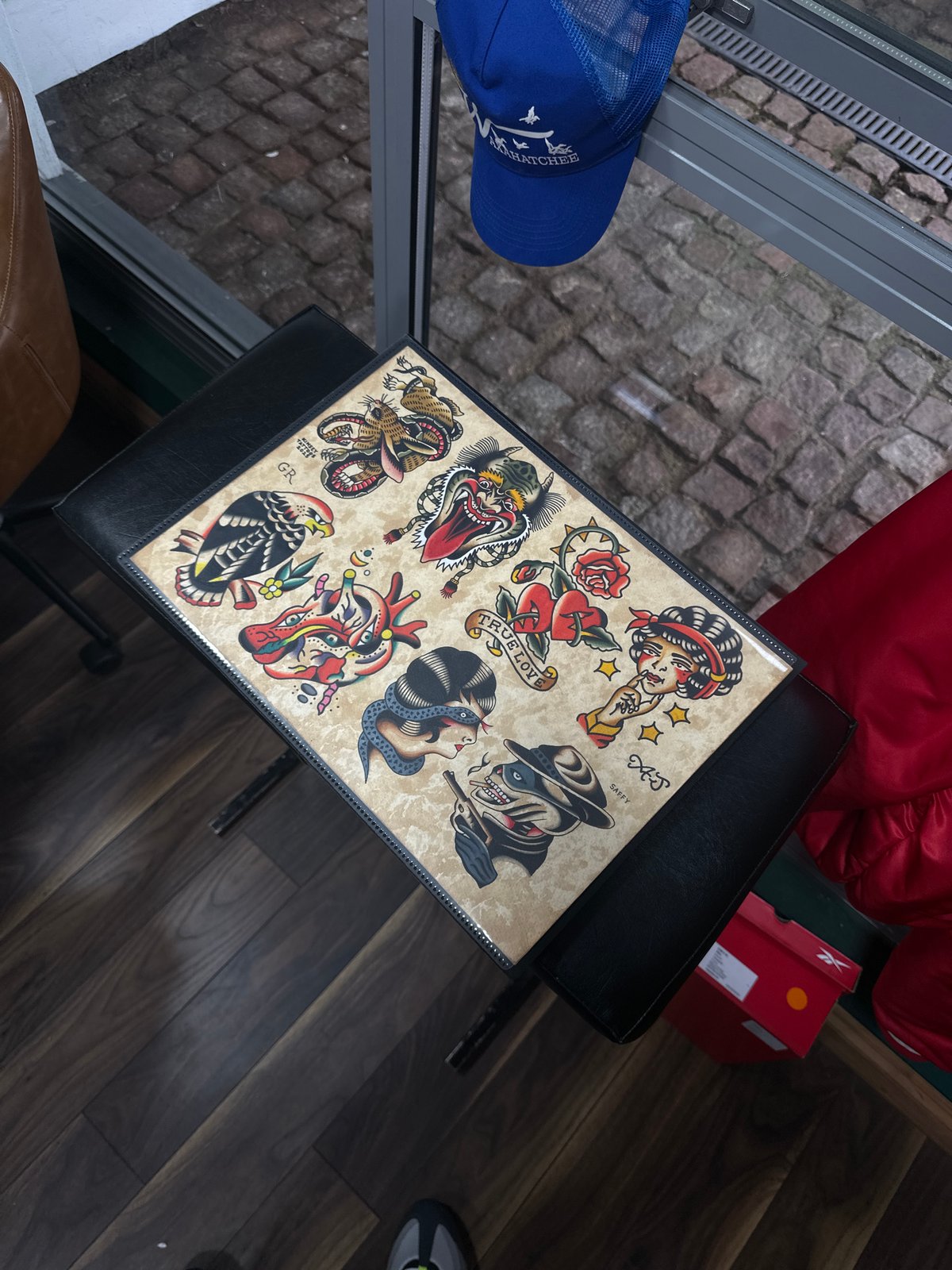 Tattoo artist works on client at Brighton studio