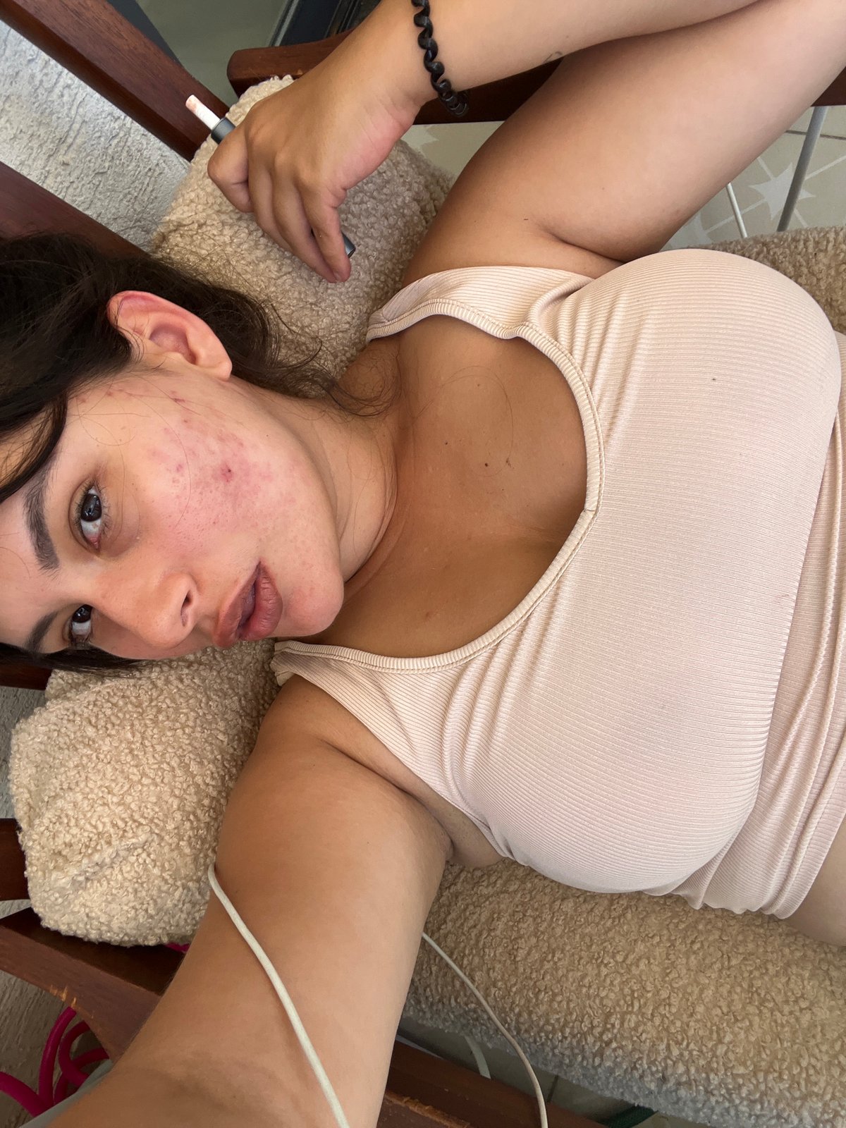 Resting on a cream cushion in Kiryat Bialik