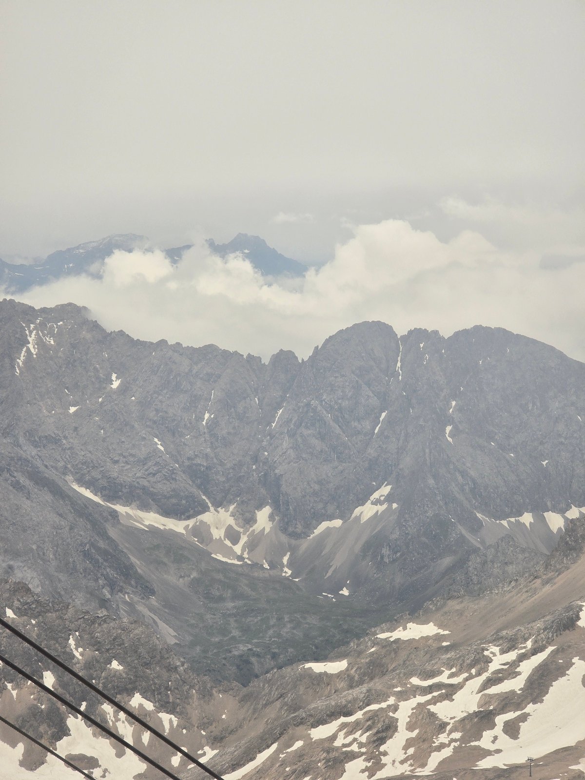 Cable car ascent through the misty Bavarian Alps