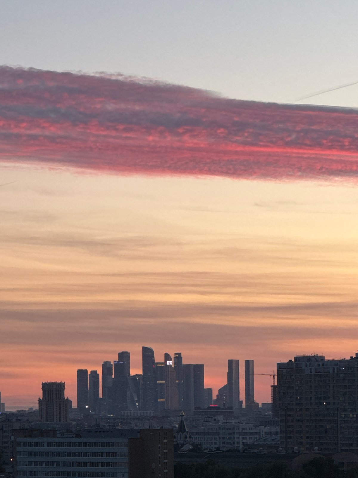 Dramatic sunset cityscape captured from elevated viewpoint in Ukromne