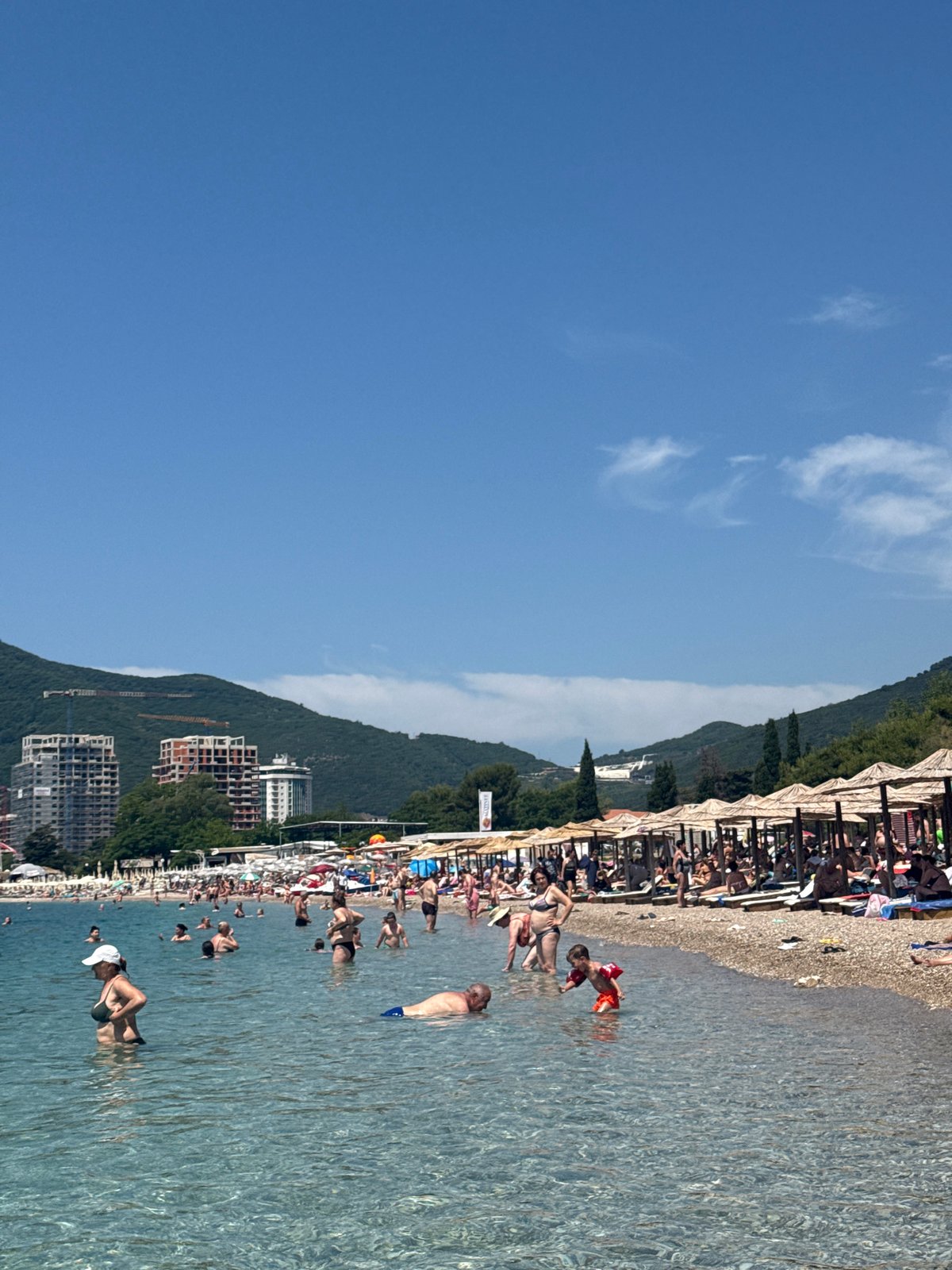 Crowds enjoy sunny morning at Boreti beach, Montenegro