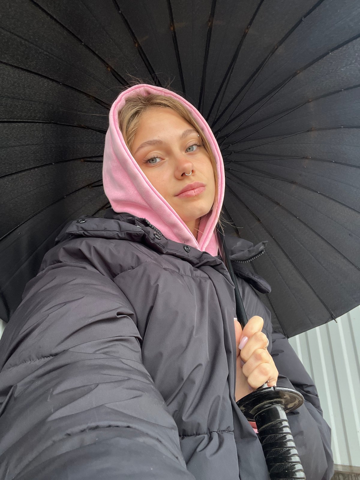 Young woman with umbrella spotted in early morning Foky