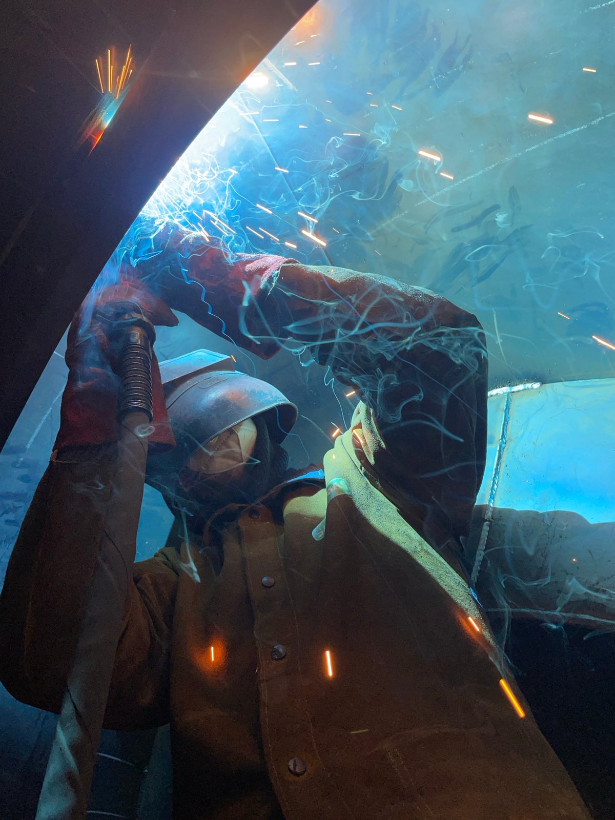 Welder works on metal beam in Zaljevo Montenegro