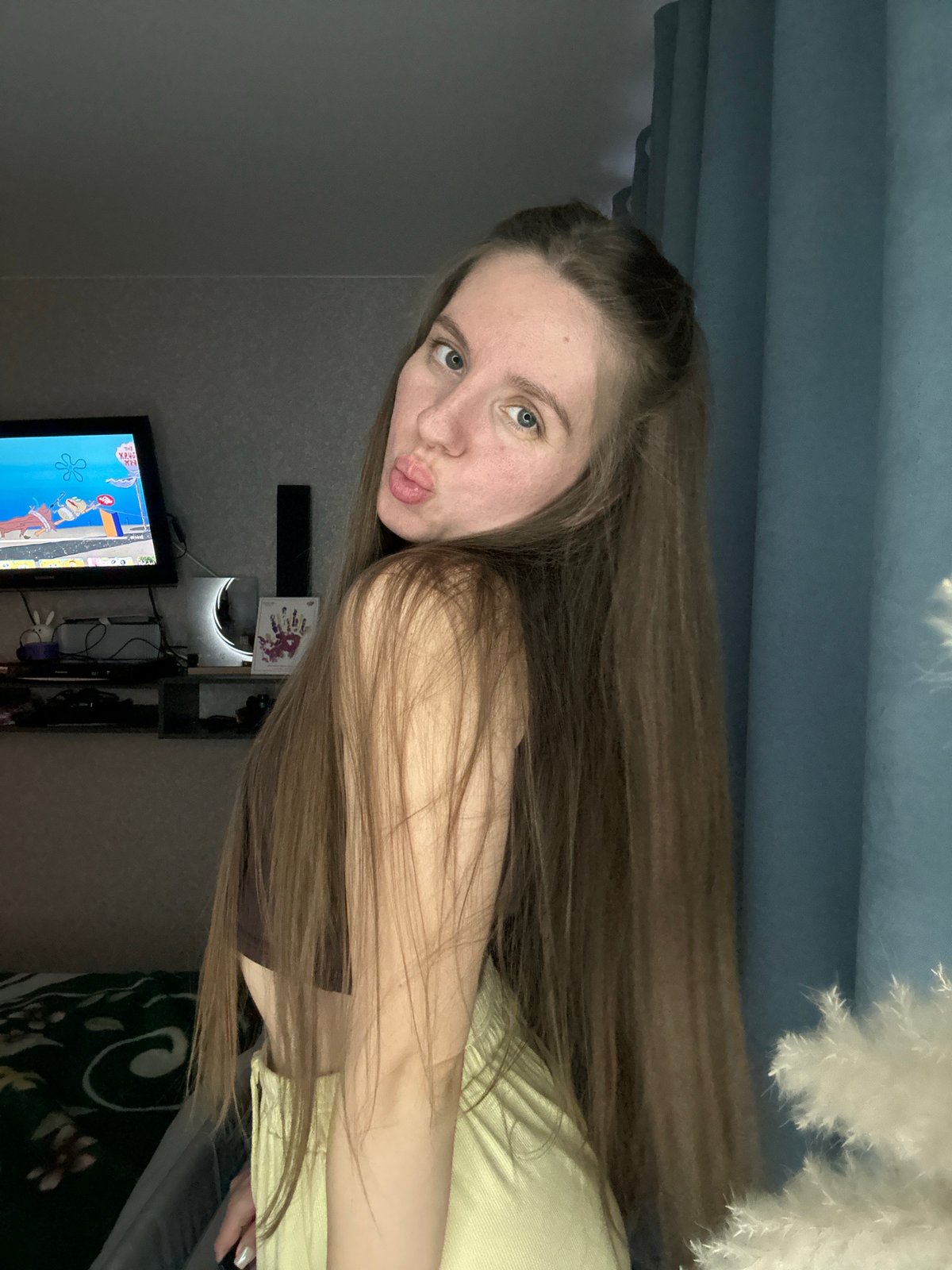 Woman takes multiple selfies in bedroom in Klin, Russia