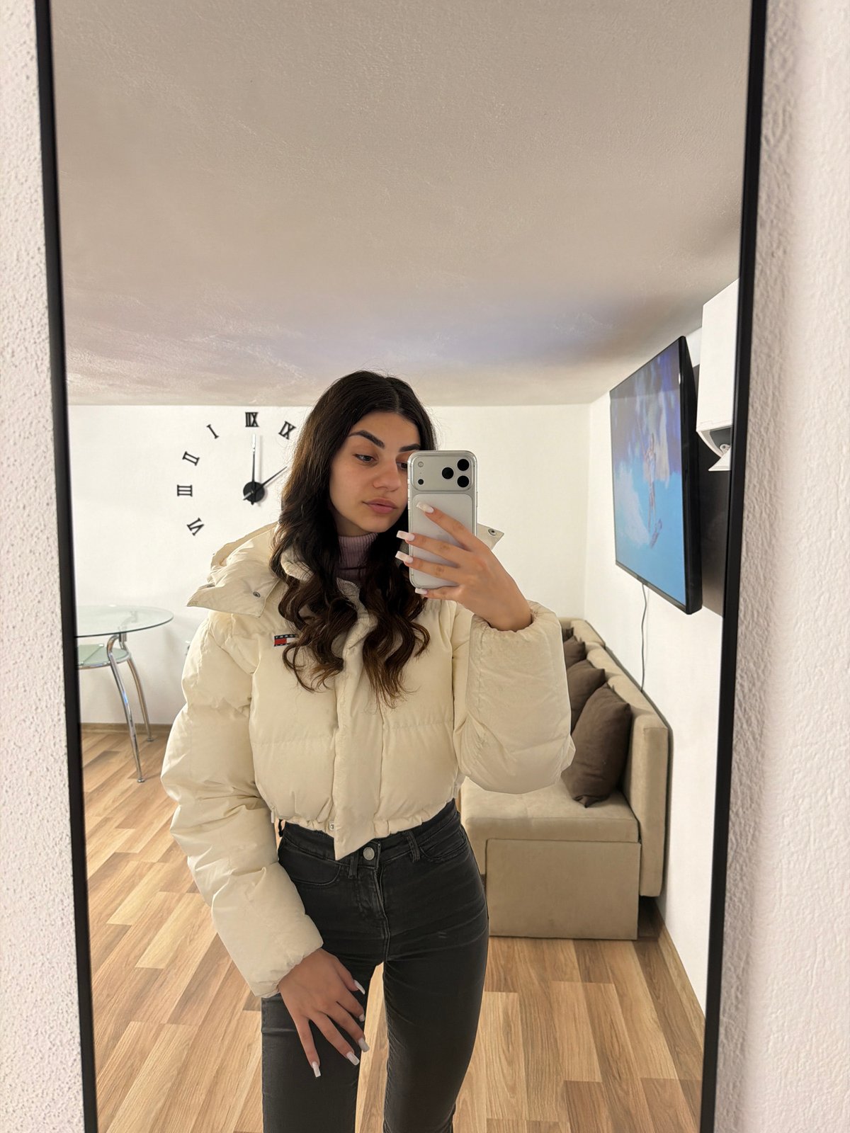 Woman takes mirror selfies in Gabrovo, Bulgaria morning