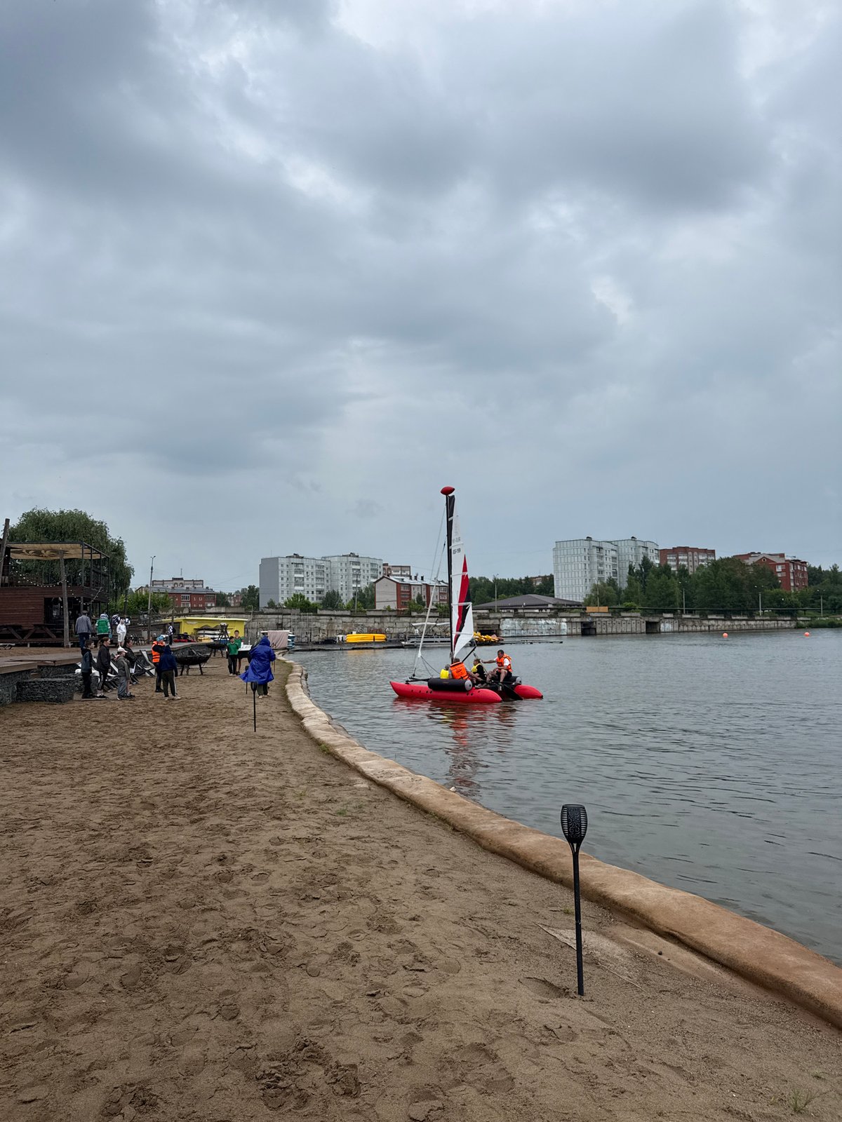 Sailing event at Votkinsk Reservoir with catamarans and shore ceremony