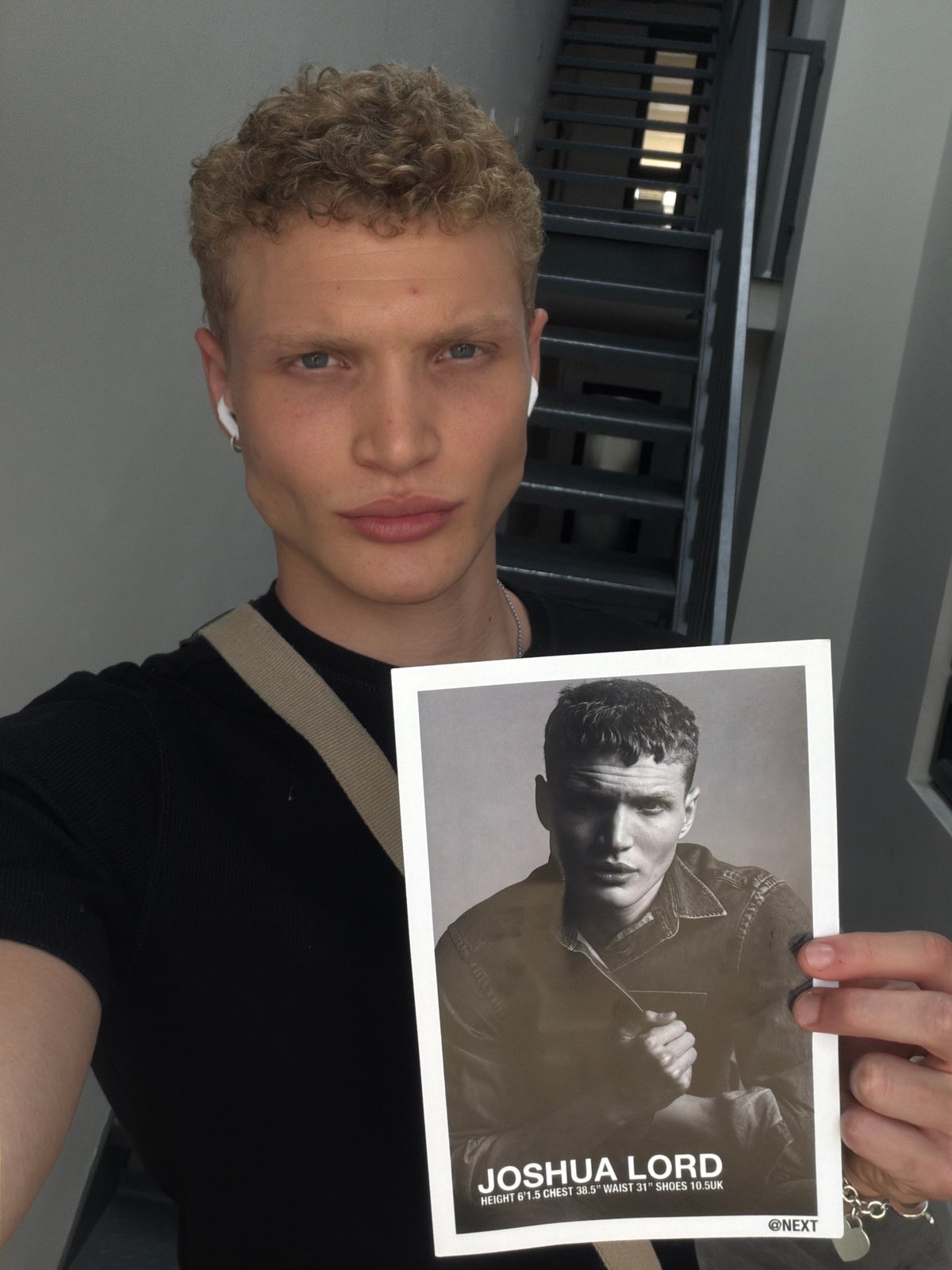 Printed photograph held up in London