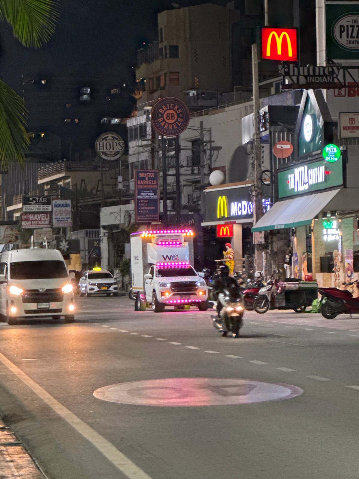 Nighttime street activity documented in Pattaya commercial district