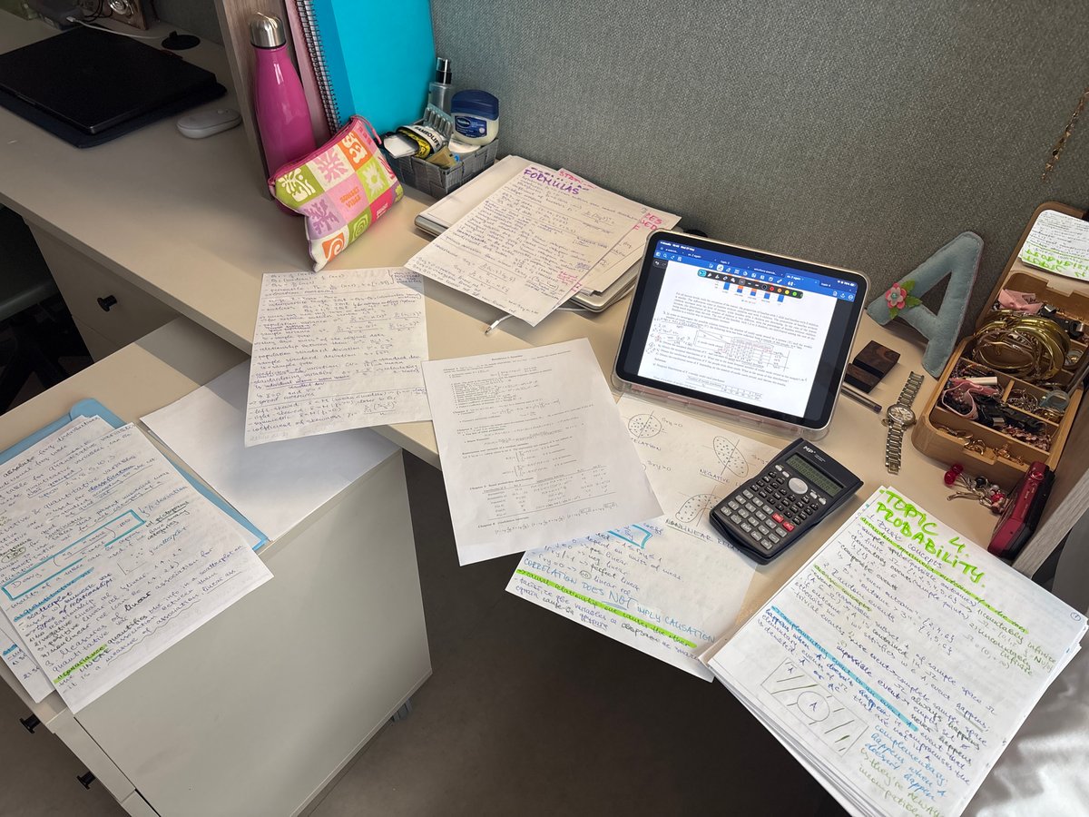 Student documents statistics study session in Getafe workspace
