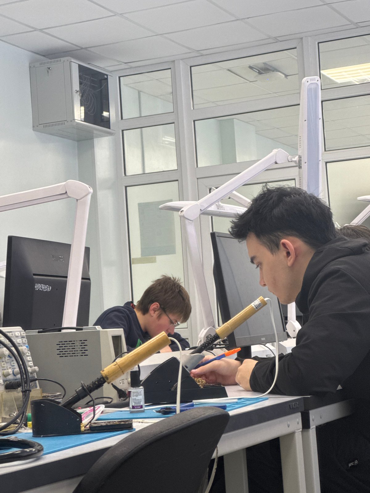 Late-night electronics work captured in Perm laboratory facility