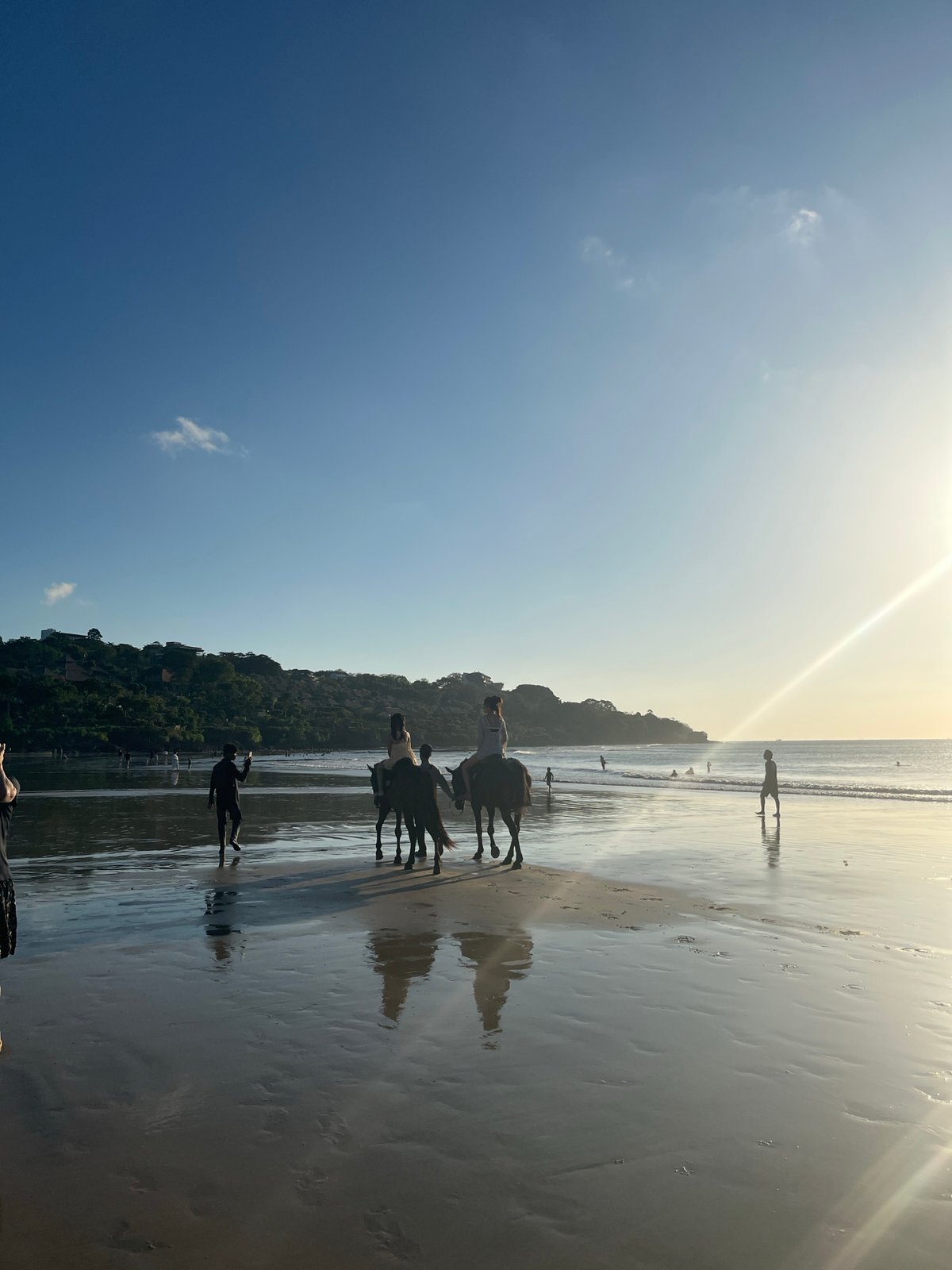 Sunset crowds along the rocky shore of Kuta Selatan