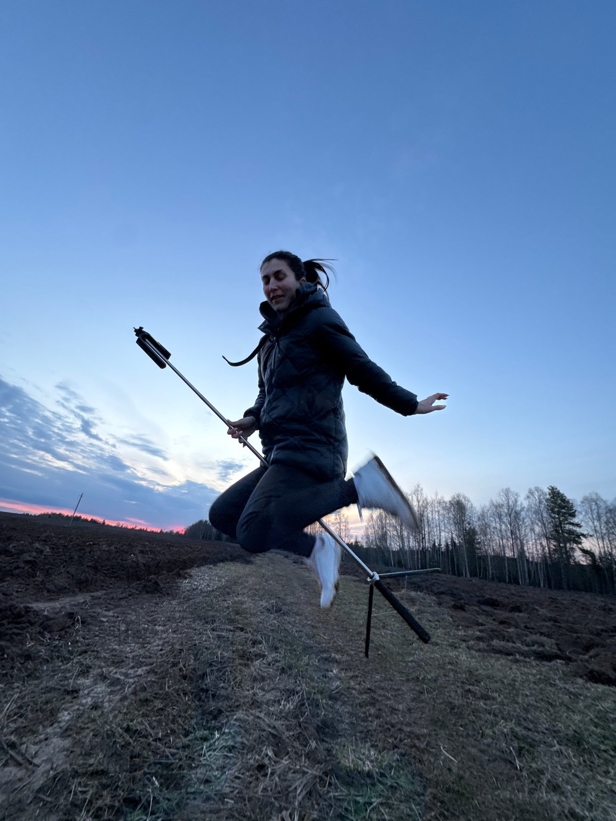 Person photographs rural sunset walk near Vassyata, Russia