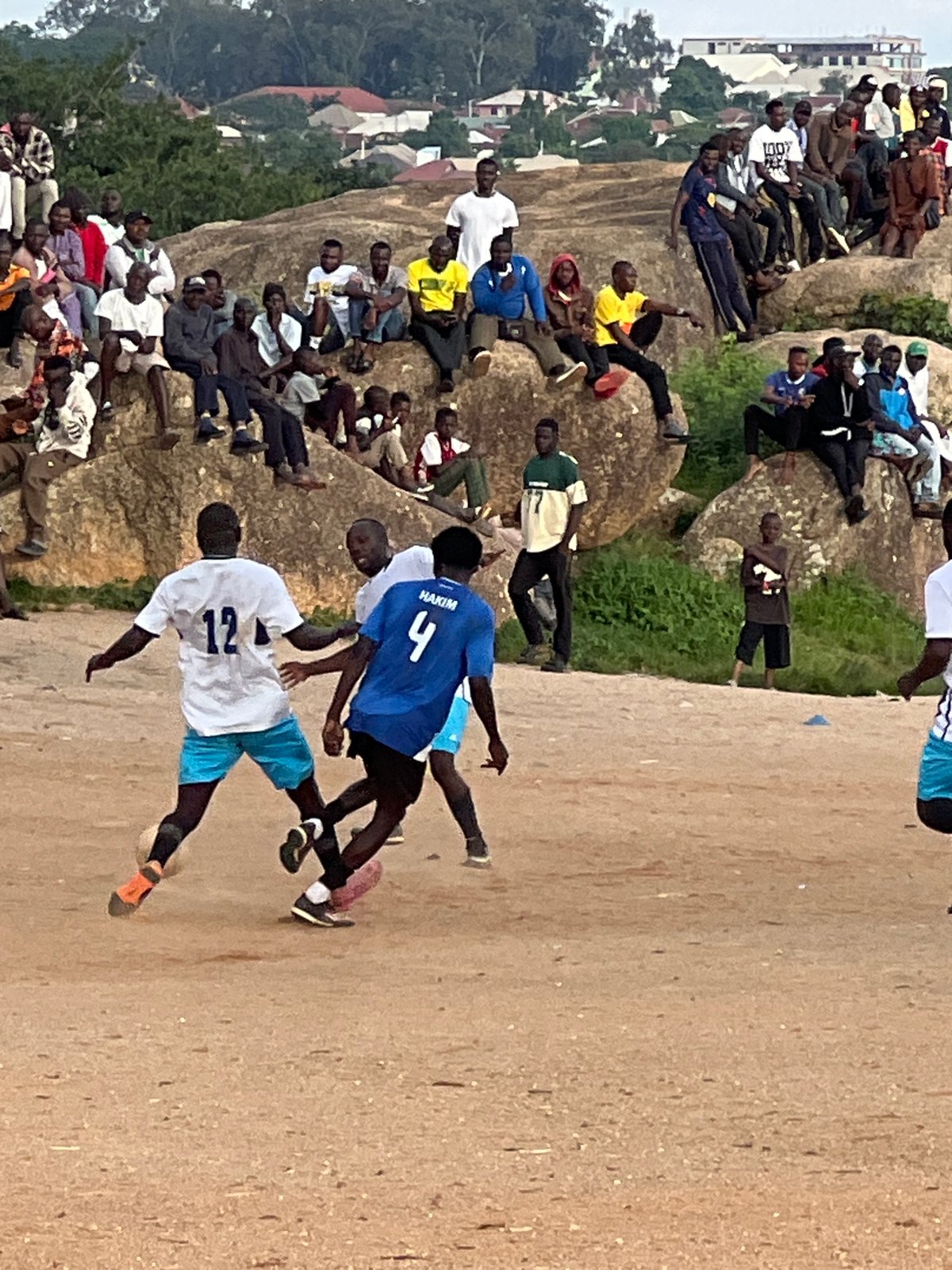 Pickup football on a dusty pitch in Jos, Nigeria