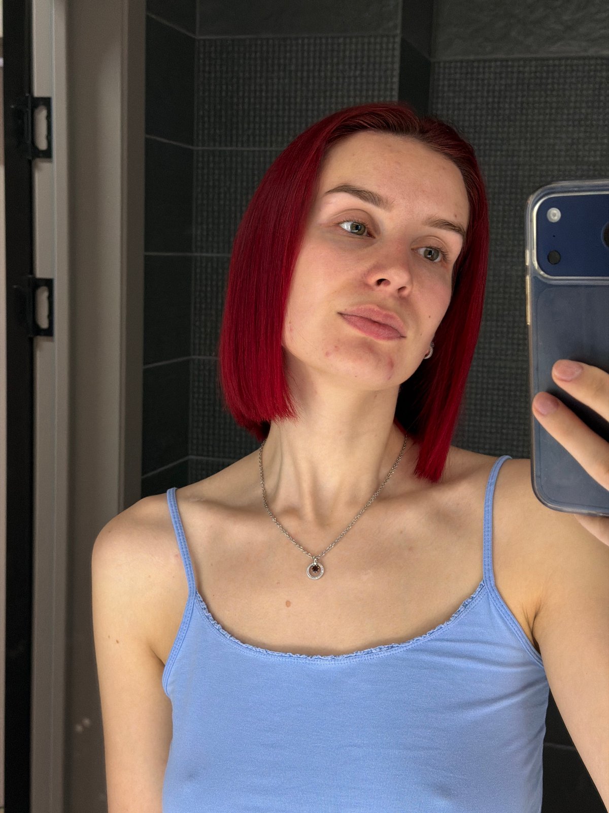 Woman takes selfies indoors in Chaikovsky, Russia
