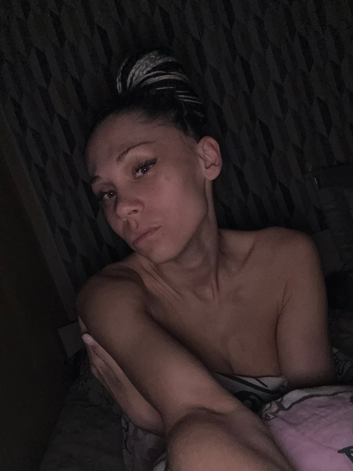 Woman resting in dimly lit room in Rusanovo