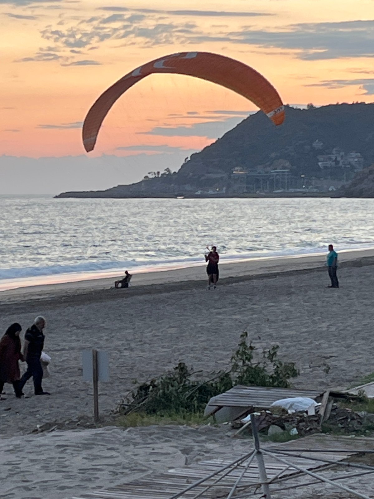 Paragliding activity observed at Alanya beach during sunset